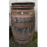 A Large Wood & Metal Bound Barrel, with four circular barrel covers, (5)