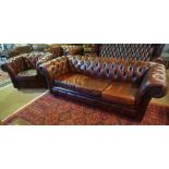 A Chesterfield Ox Blood Leather Three Piece Suite, Comprising of a club style three seater sofa,