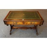 A Walnut Sofa Table, with a green and gilt tooled leather surface to the top, flanked with a drop