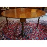 A Victorian Figured Walnut Centre Table, With D shaped drop ends, raised on scroll and plain