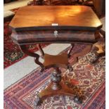 An Early Victorian Mahogany Work Table, With a hinged top enclosing a fitted interior, above a
