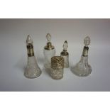 Five Assorted Silver Mounted Glass Toilet Bottles/Jars, circa early 20th century, four examples with