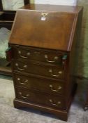 A Good Quality Reproduction Ladies Mahogany Writing Bureau, With a fall front enclosing fitted