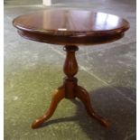 A Victorian Style Hardwood Tripod Table, with circular top raised on a turned column and tripod