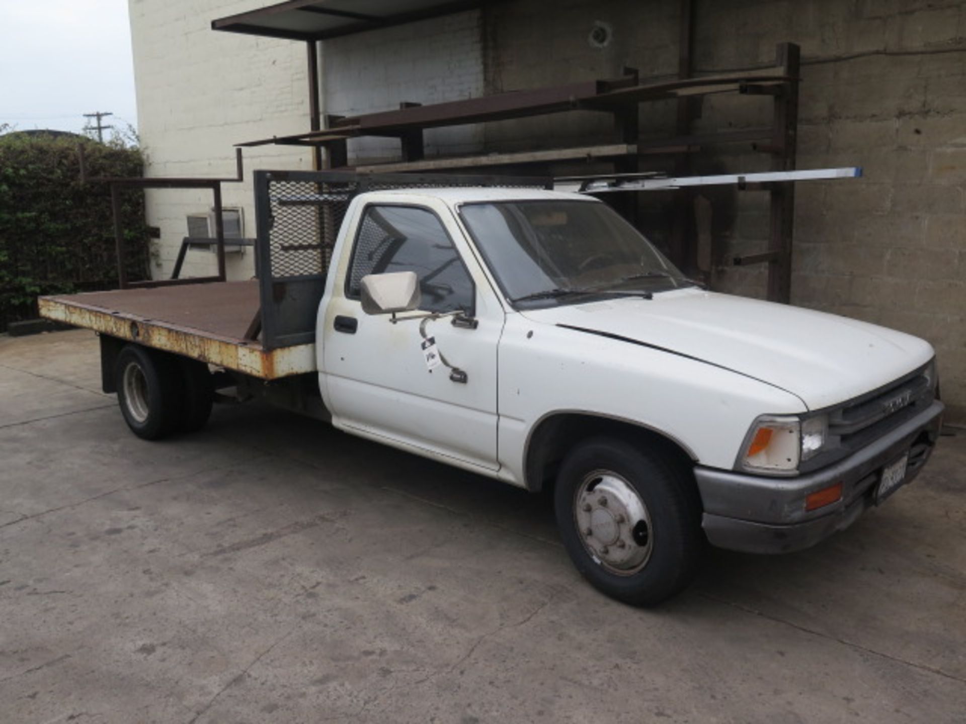 1991 Toyota 9’ Stake Bed Truck Lisc # 4F45131 w/ V6 Gas Engine, Automatic Trans, Dual Rear Wheels,