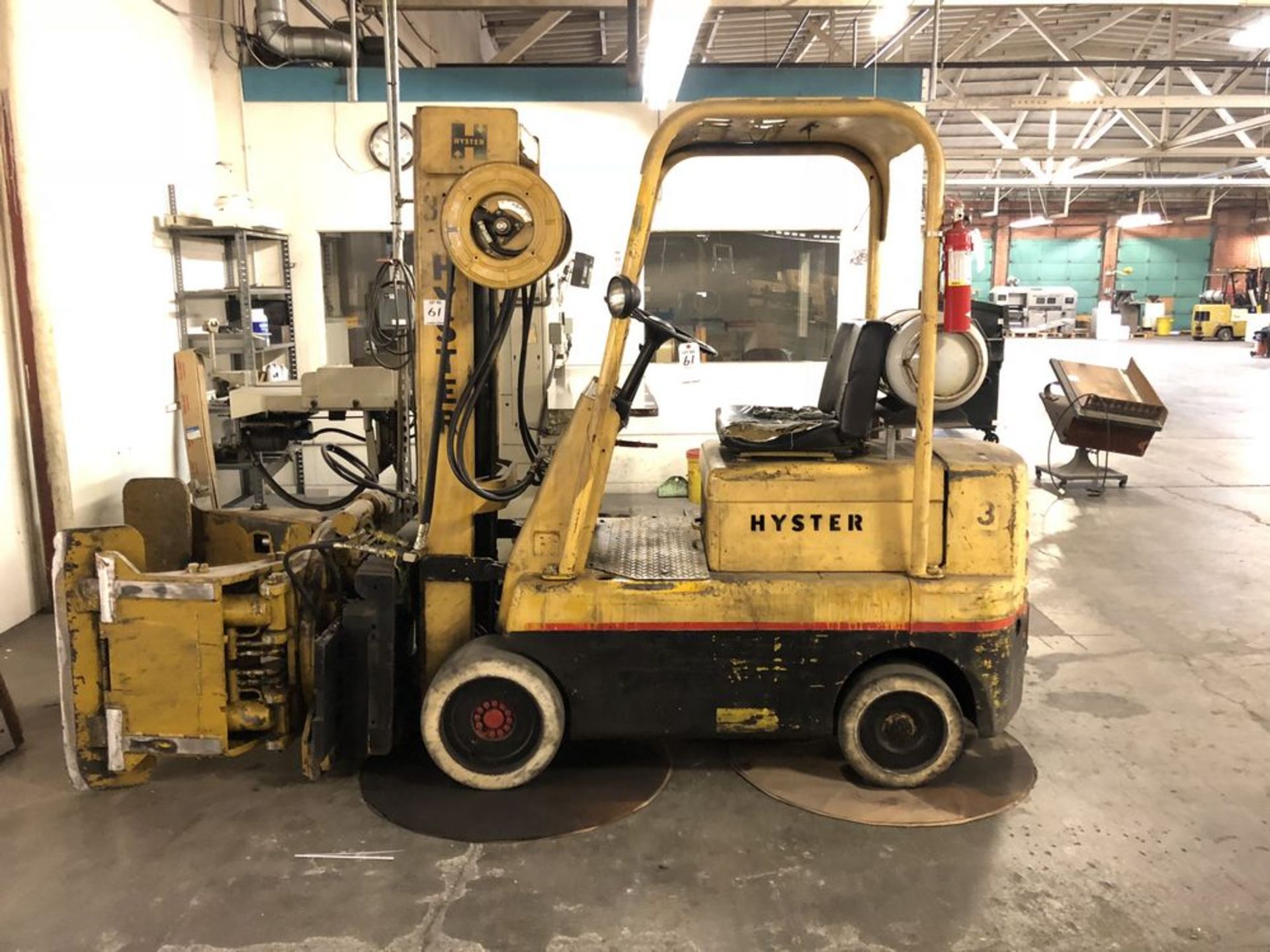 (1) Hyster S50C Forklift- 5,000 lb cap 3 stage mast, 360 degree barrel clamps (no forks), solid