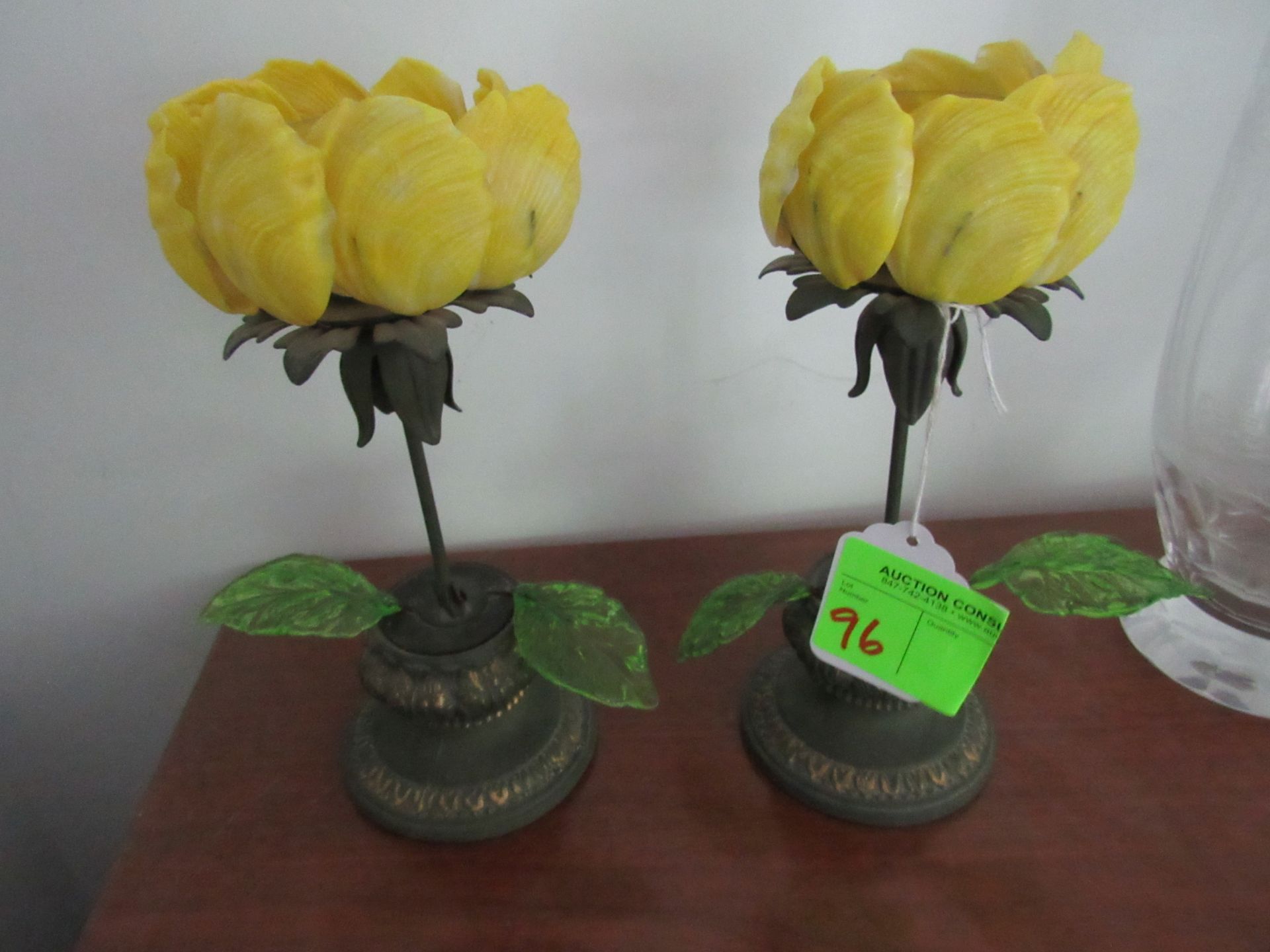 Two porcelain flowers with cast base and candleholders, height 10”