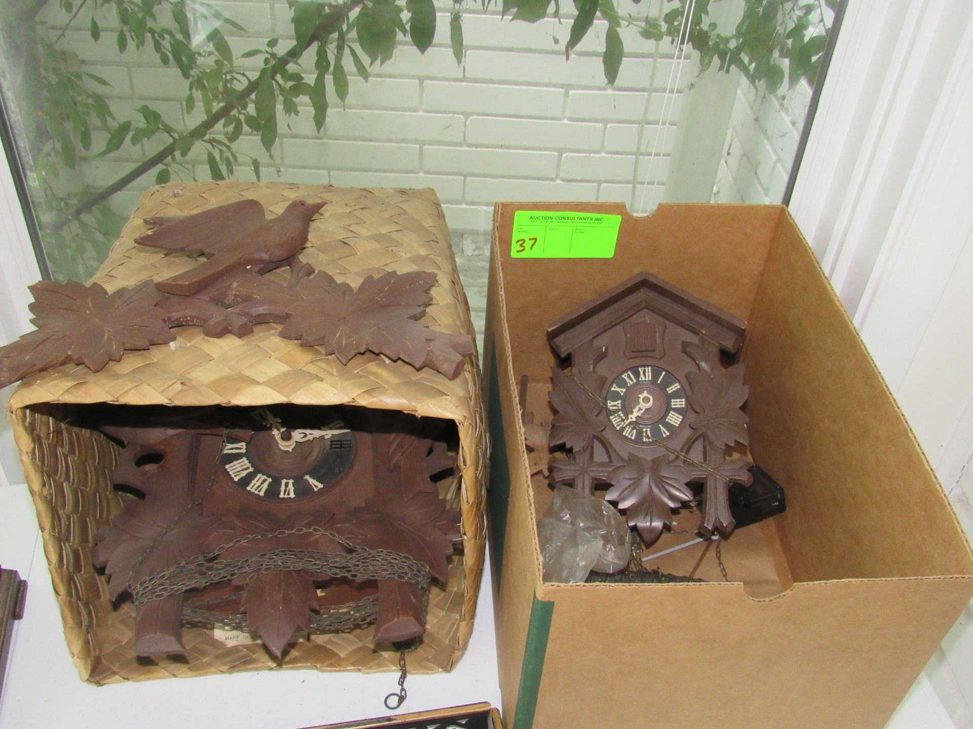 Two cuckoo clocks