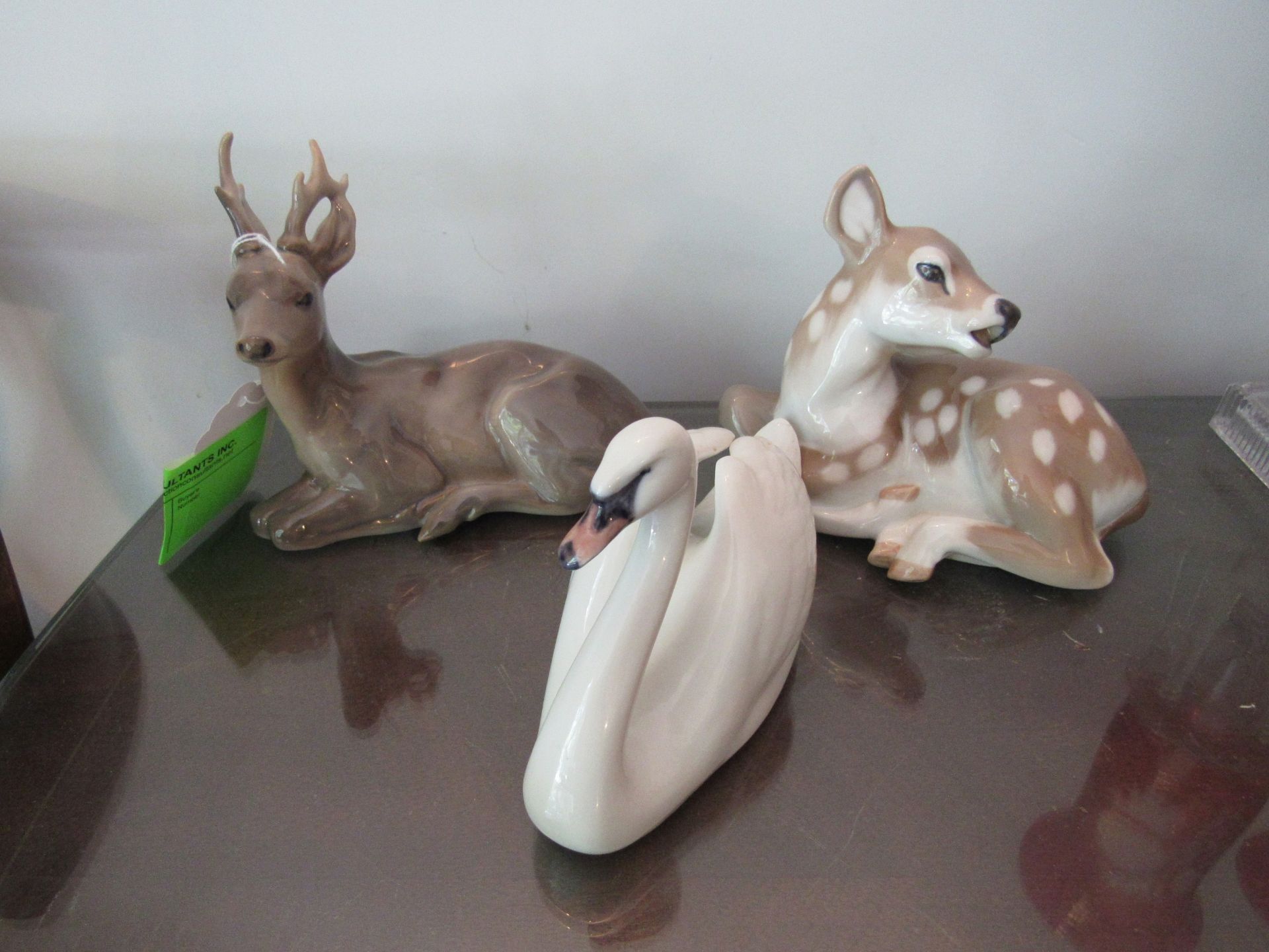 Three Royal Copenhagen figurines: stag, fawn and swan
