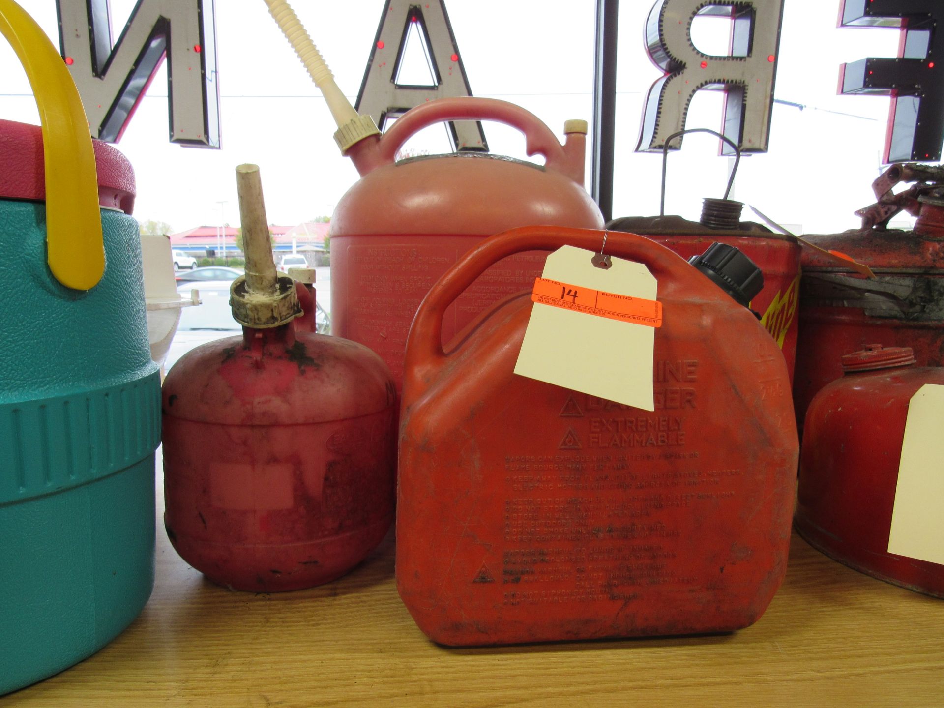 Three plastic gas cans