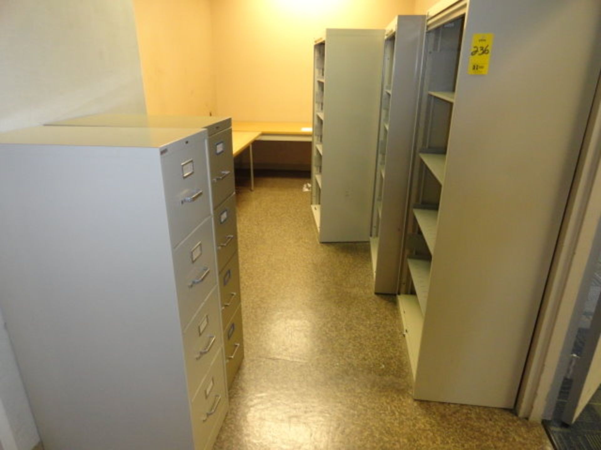 Office Furniture: (3) 5 Shelf File Cabinets with roll up door, (1) 6' Table, (1) 8' Table, (2) 4