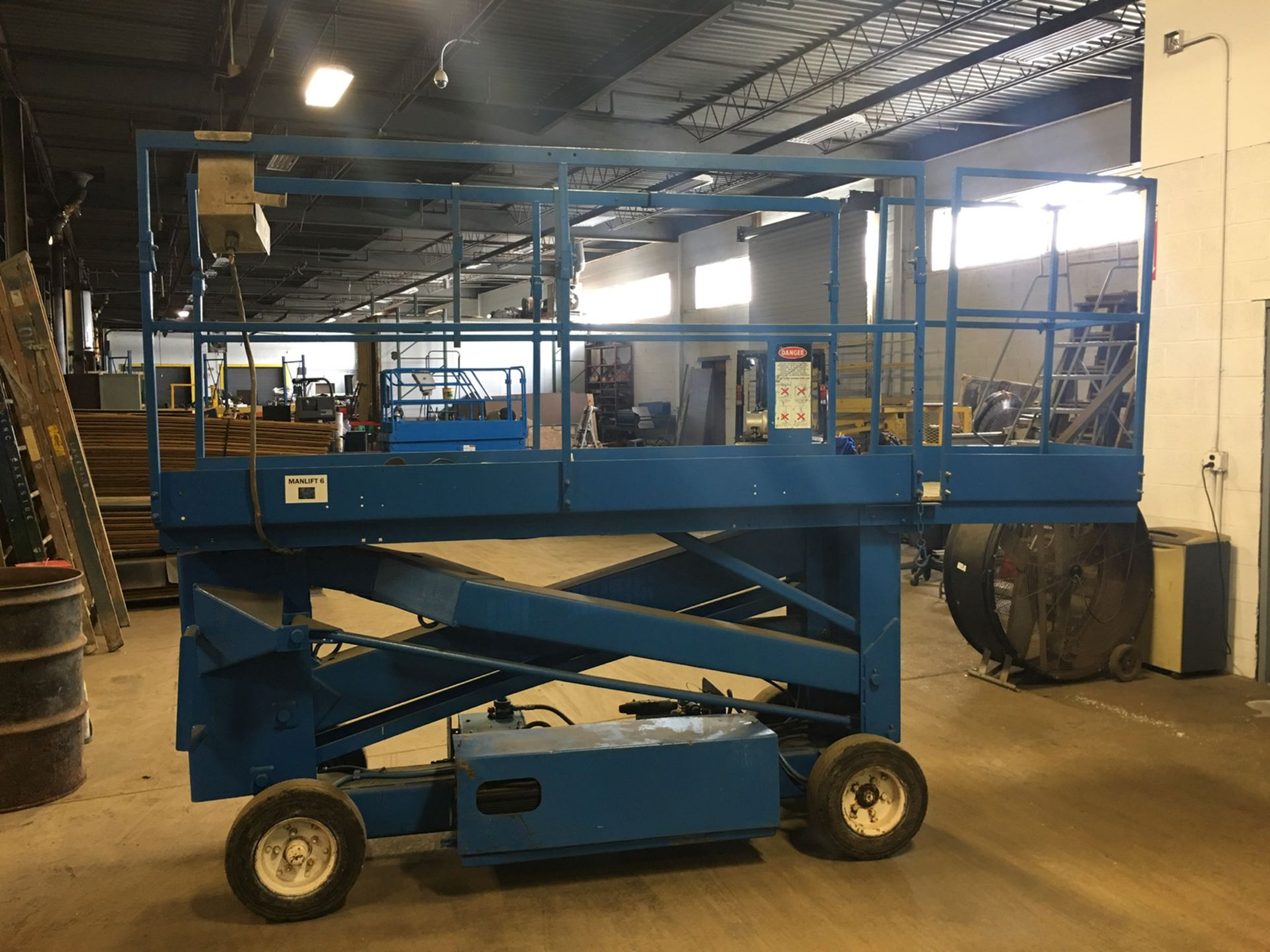 Up-Right-Inc battery powered scissor lift. Model 6300-B, serial 3027, 20 ft height