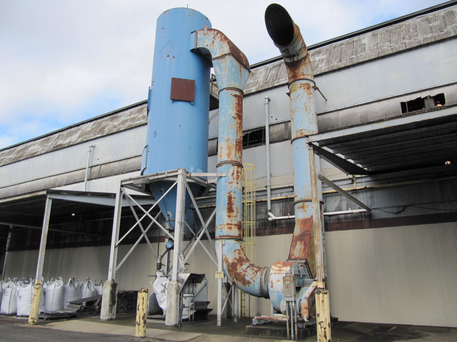 Dust collector, cone bottom, approx. 28' straight side, 10' dia., on steel legs, 100 hp blower