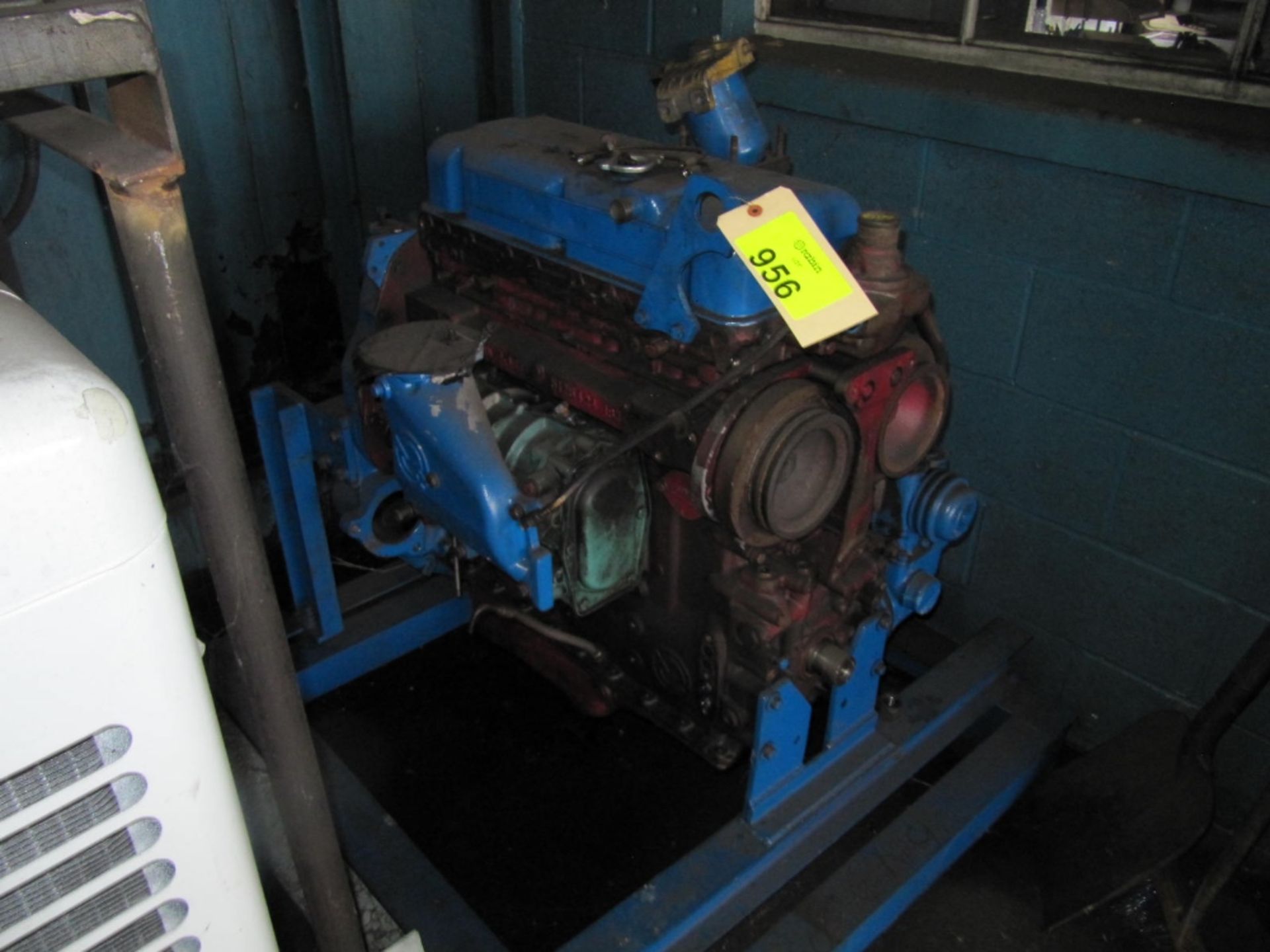 Detroit diesel engine, on stand, includes assorted parts on pallet