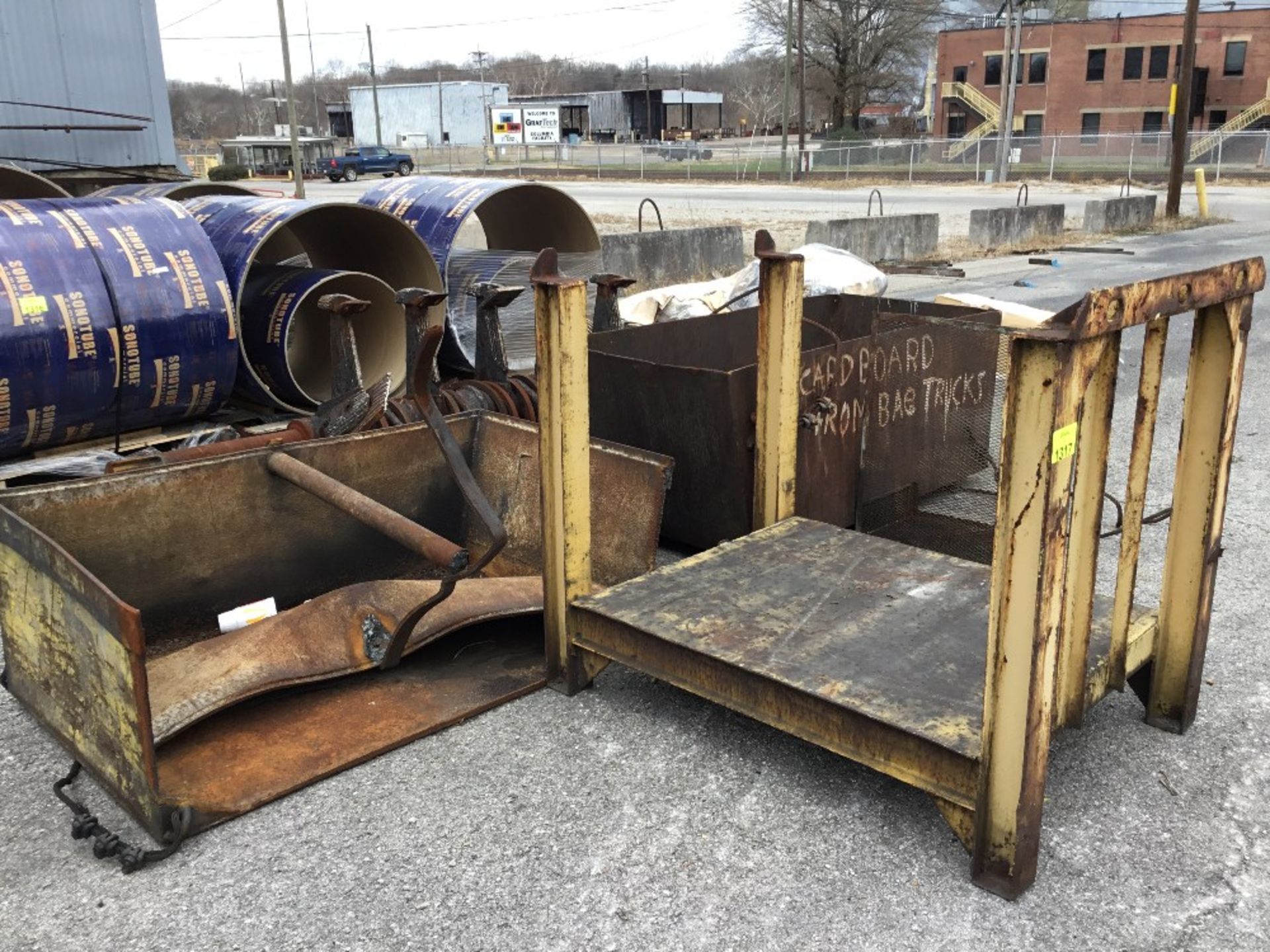 Lot of assorted steel scrap including (1) square tubings, mixing paddles, crane hoppers, and steel