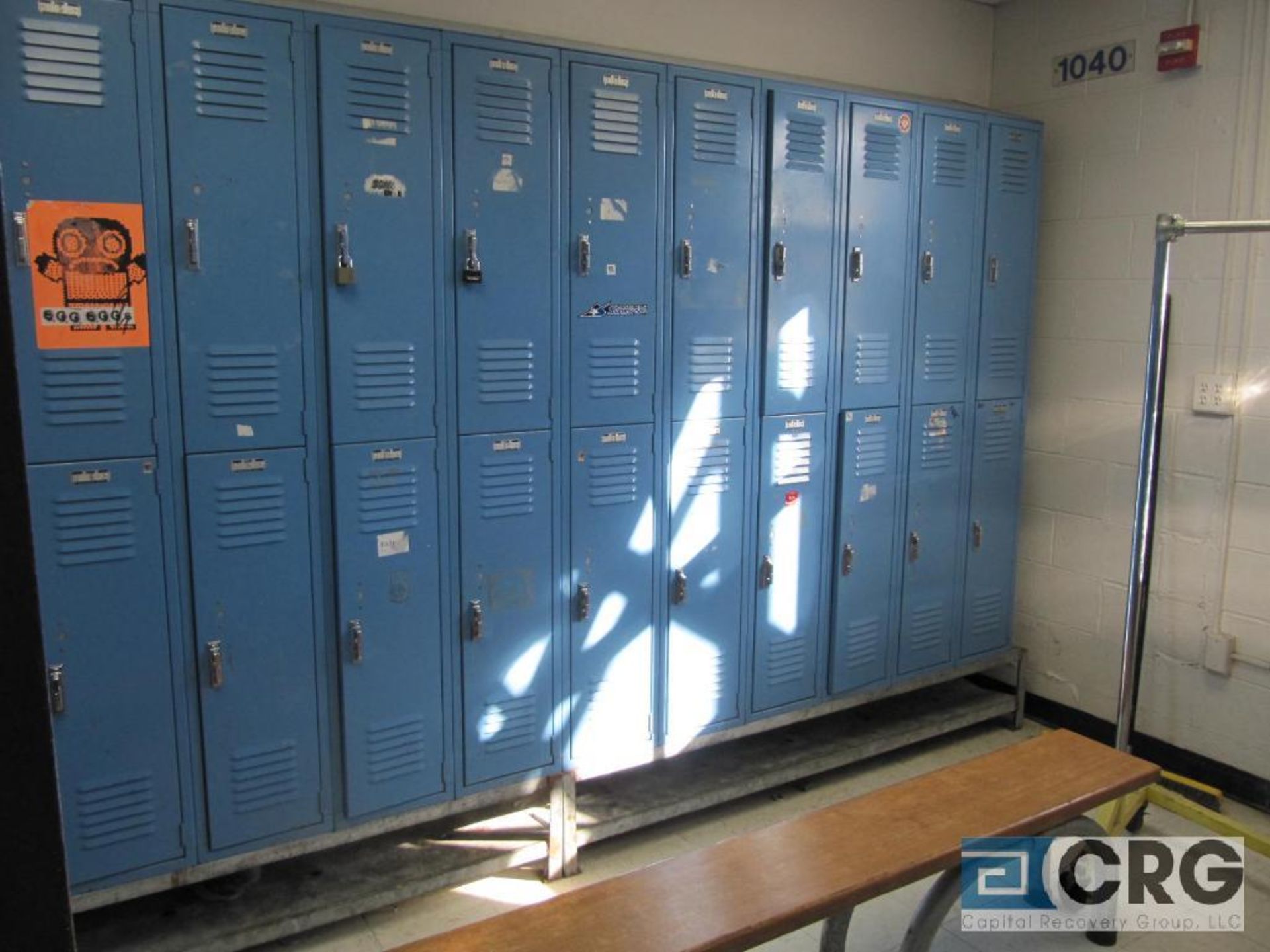 Lot of lockers with (42) total, bench and garment rack