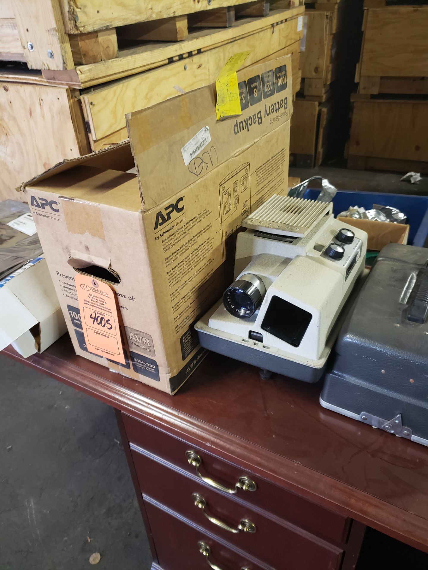 (1) APC BATTERY BACKUP 600W 8 OUTLETS (1) REVERE AUTO MAGAZINE PROJECTOR (LOCATED AT: 219 MURRAY