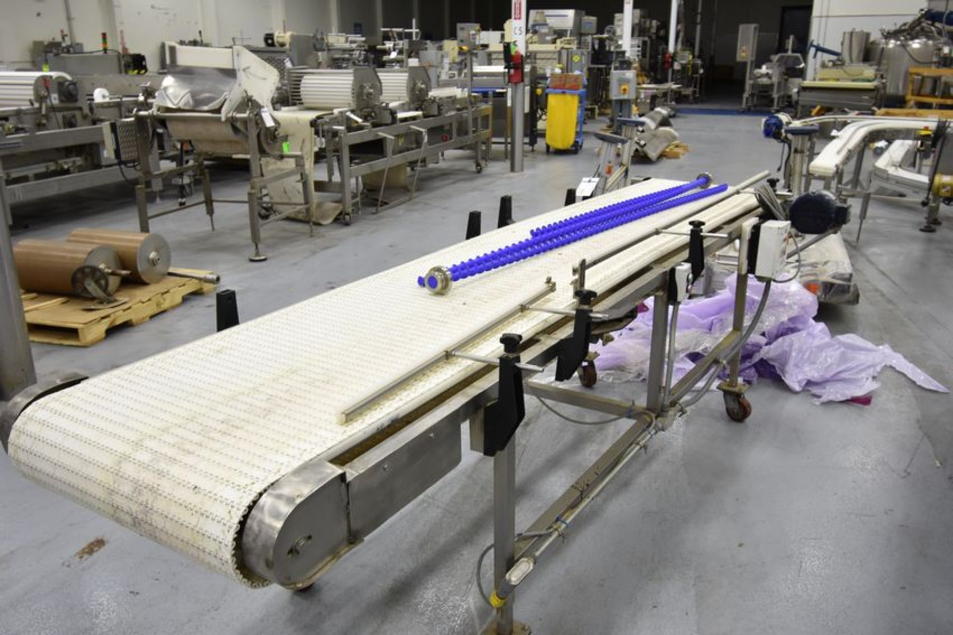 BTE Conveyor | 24"w x 130"l x 35 1/2"h intralox belt conveyor. Stainless steell frame on casters.