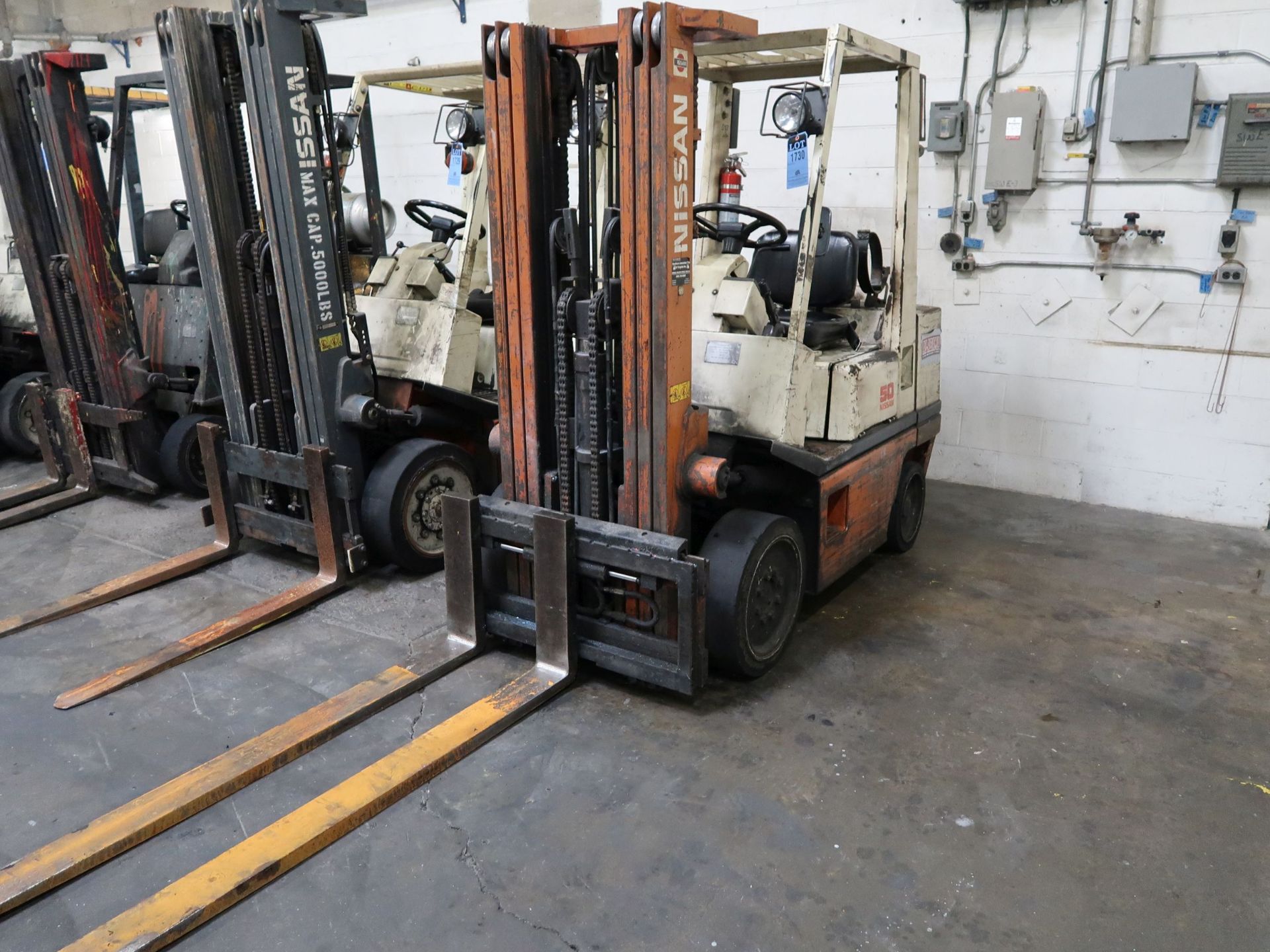 5,000 LB. NISSAN 50 LP GAS SOLID TIRE LIFT TRUCK; S/N CPH02-90442D, 3-STAGE MAST, 82" MAST HEIGHT,
