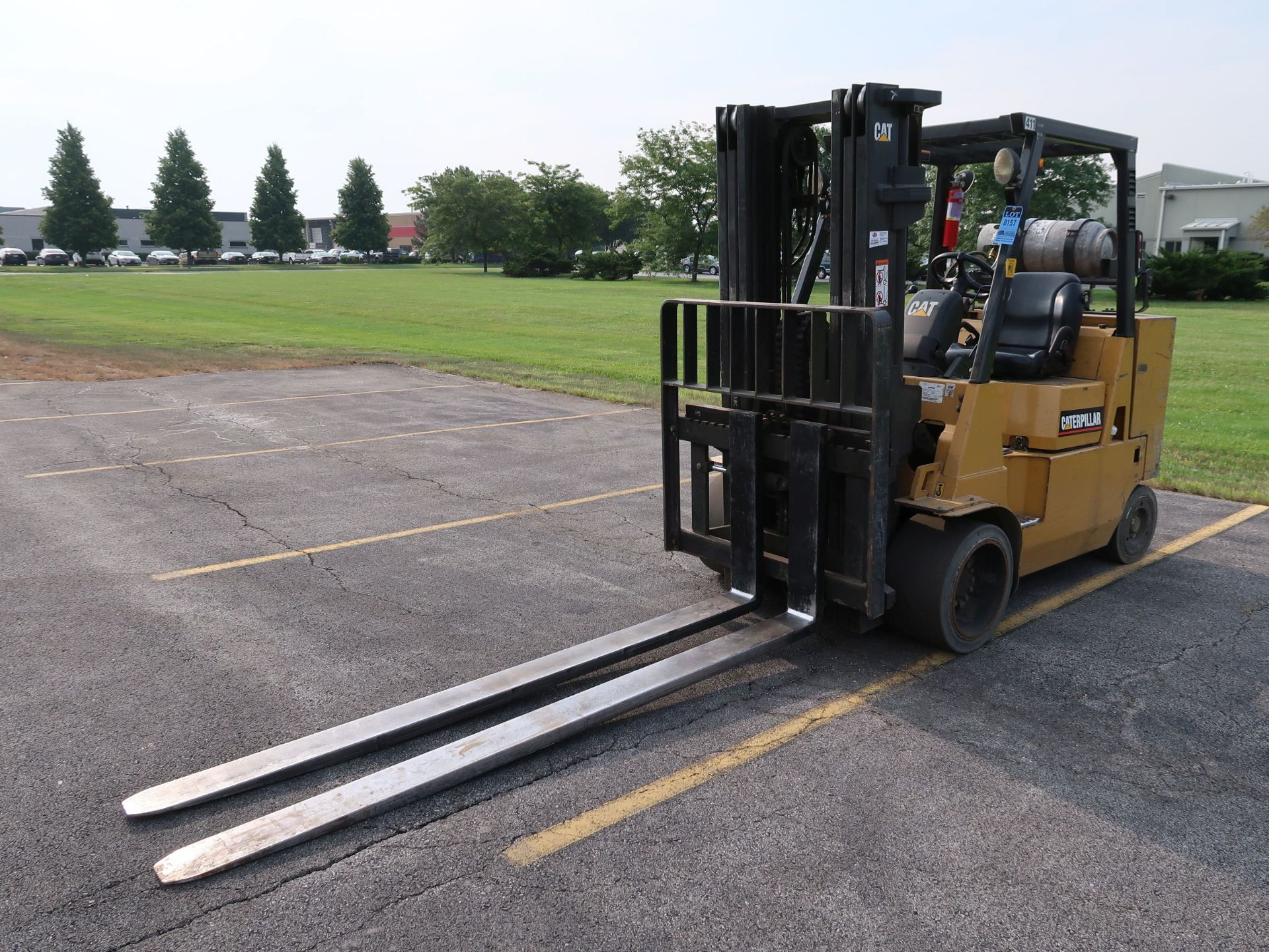 11,000 LB. CATERPILLAR MODEL GC55K LP GAS SOLID TIRE LIFT TRUCK; S/N AT88A00317, THREE STAGE MAST,
