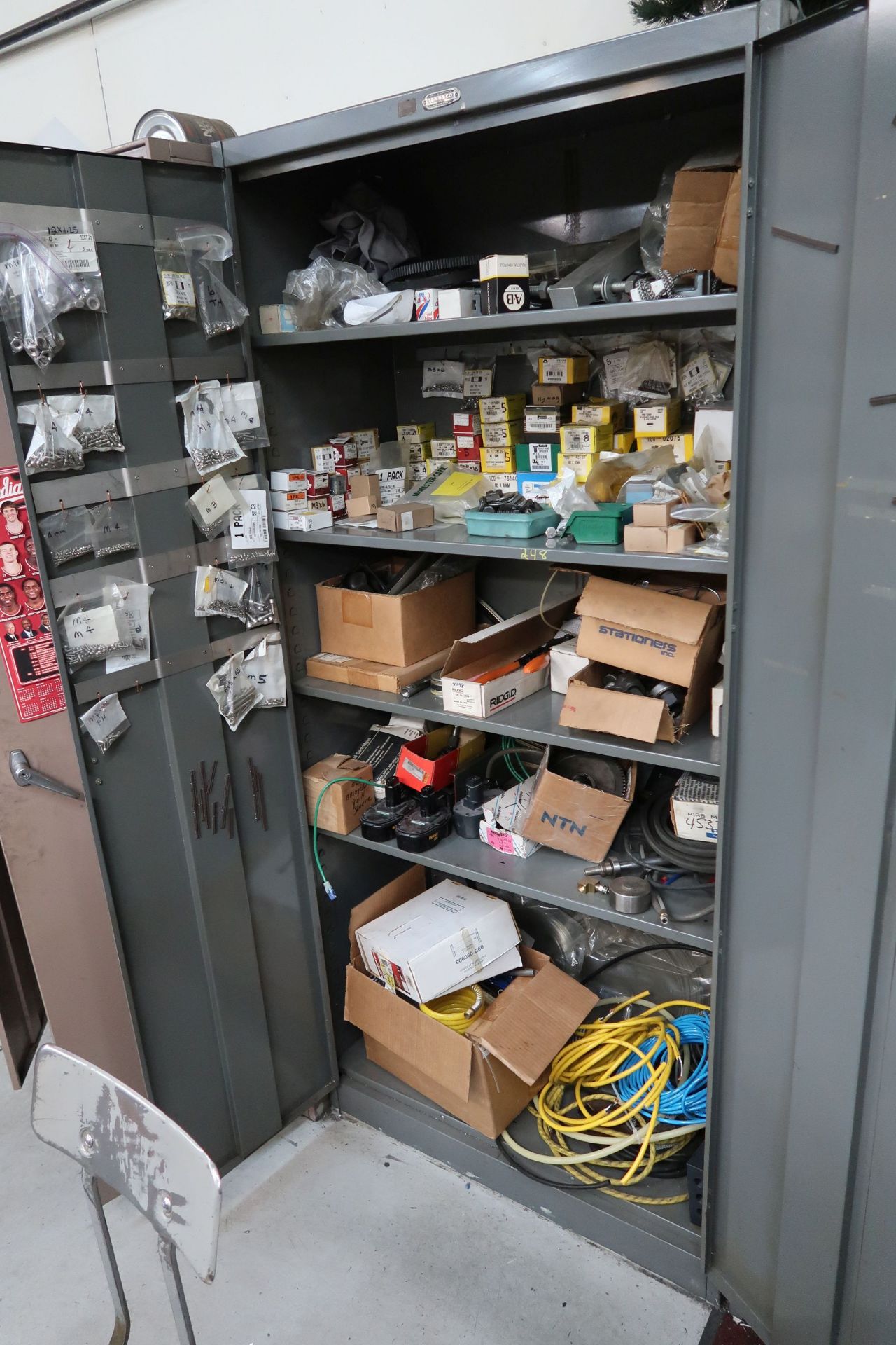 (LOT) MISCELLANEOUS HARDWARE AND MACHINE PARTS WITH STORAGE CABINET