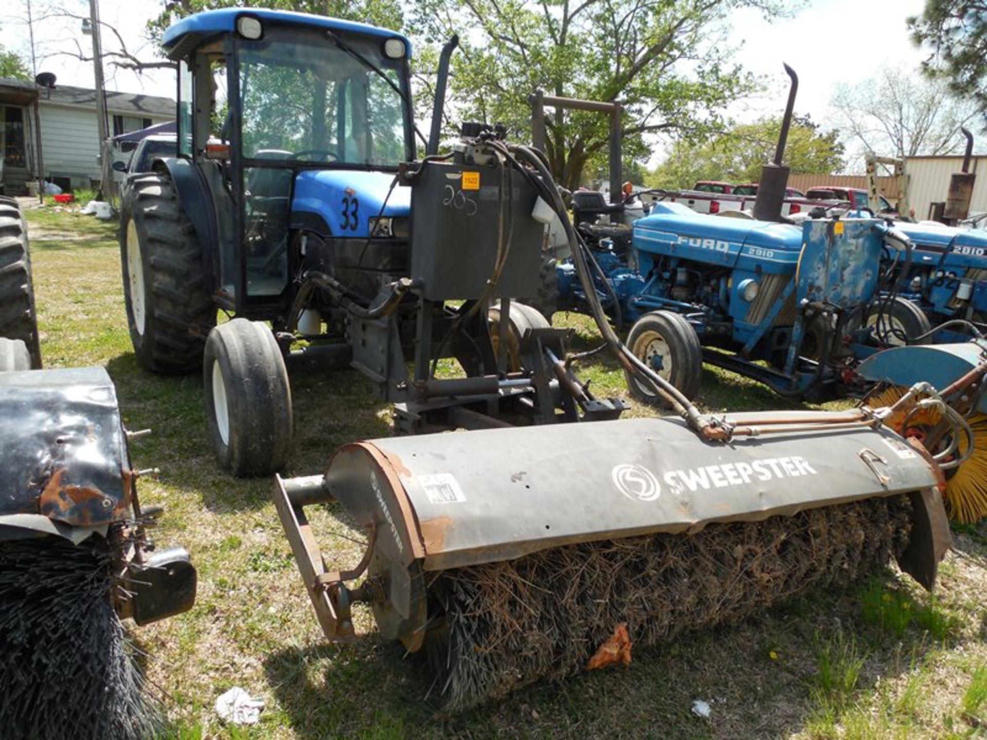 New Holland TN65 sweeper tractor cab with doors removed cab with doors removed