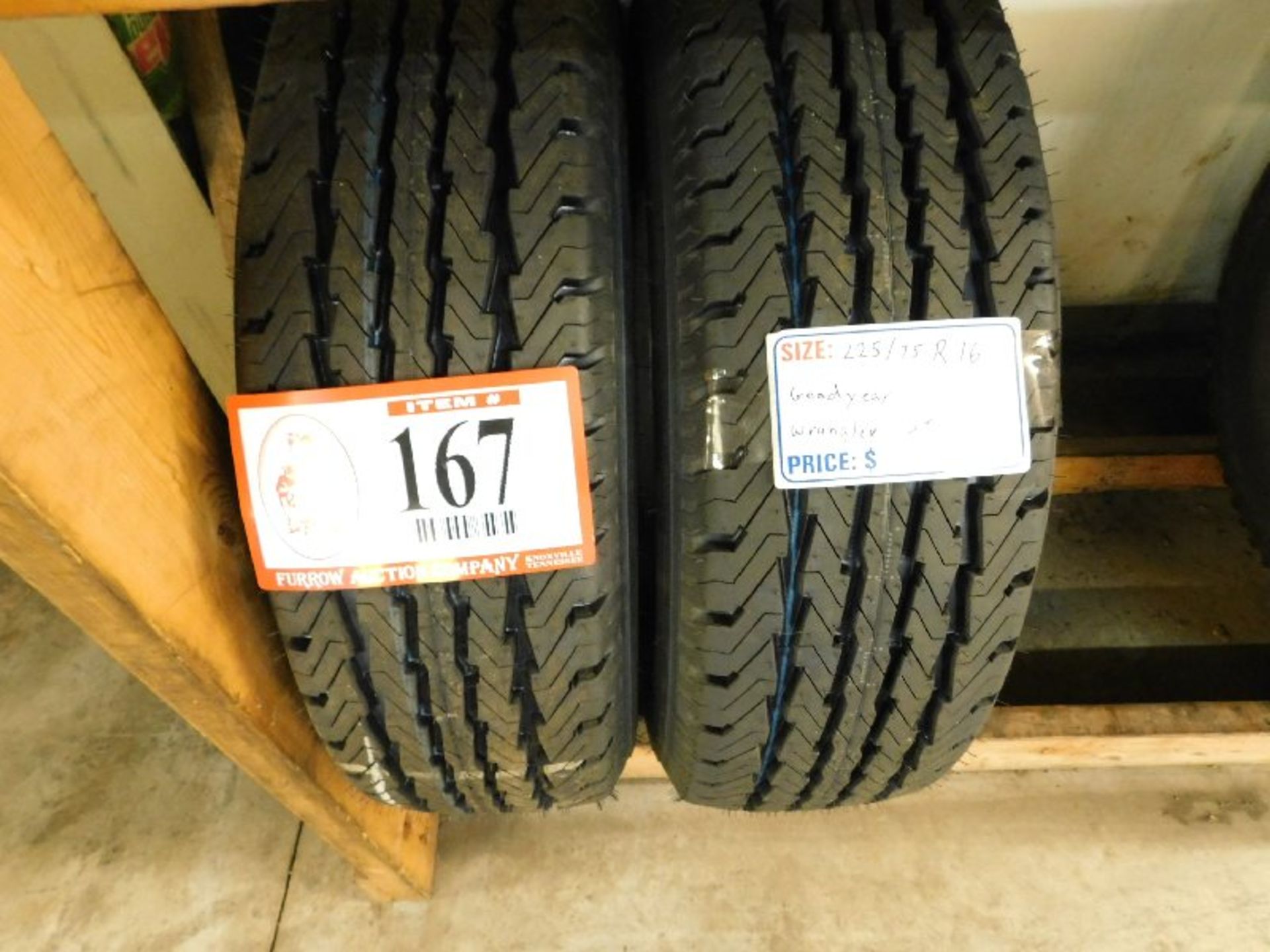 (2) Goodyear Wrangler HT Tires, 235/75R16 (TAXABLE)