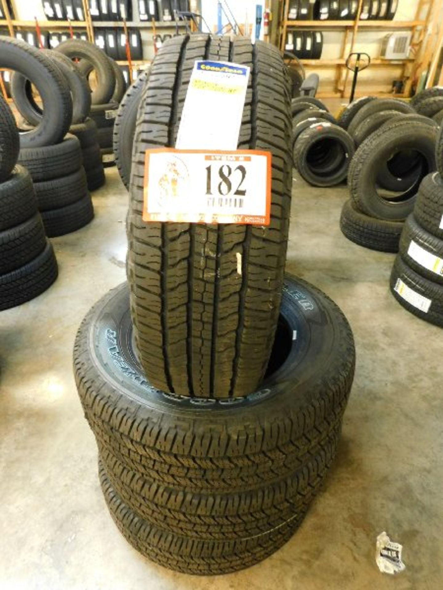 (4) Goodyear Wrangler HT Tires, 265/65R17 (TAXABLE)