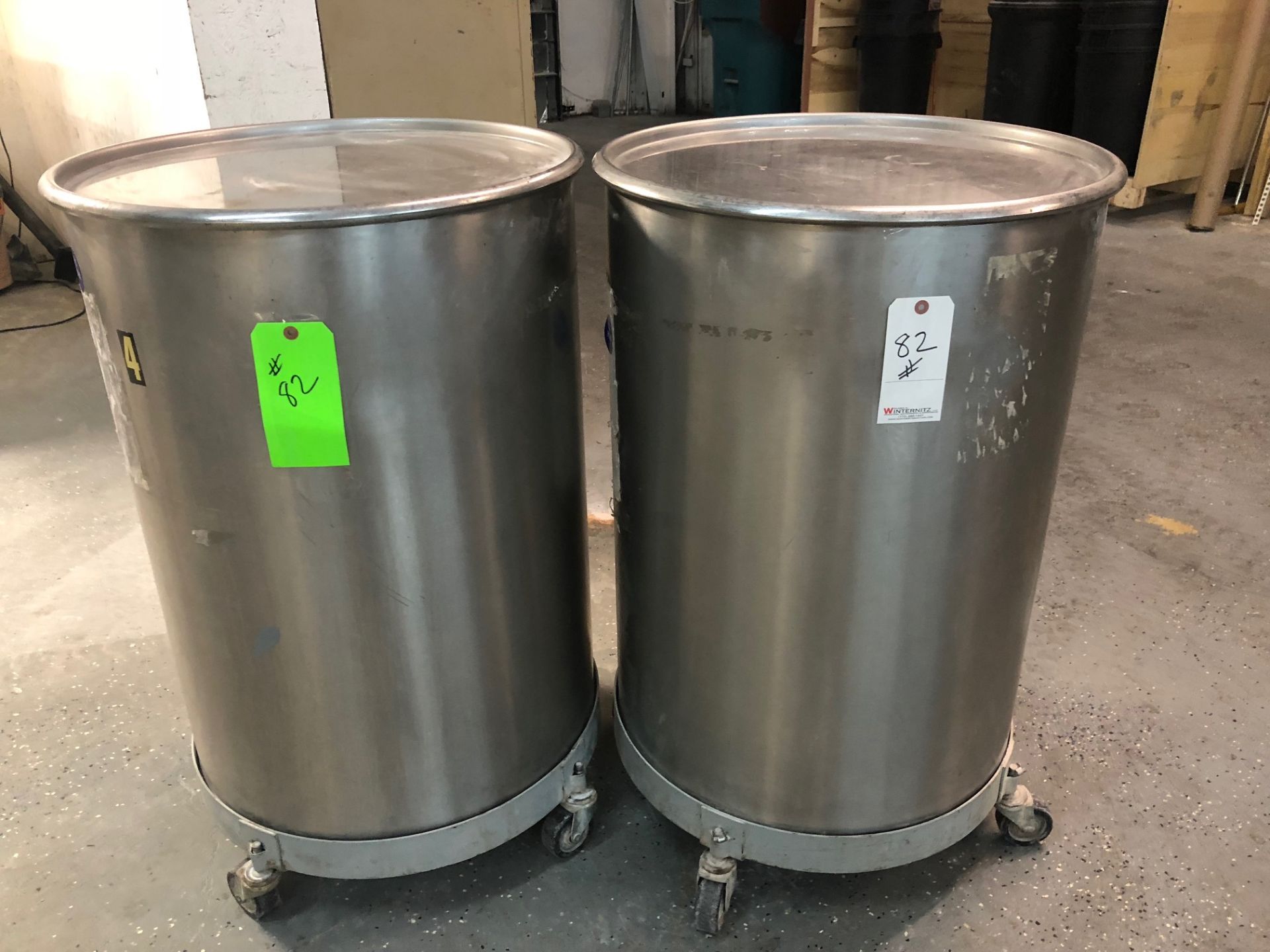 2-Stainless Steel rolling Tank Vessel on casters with covers, Size both are 24” wide round, 34” high