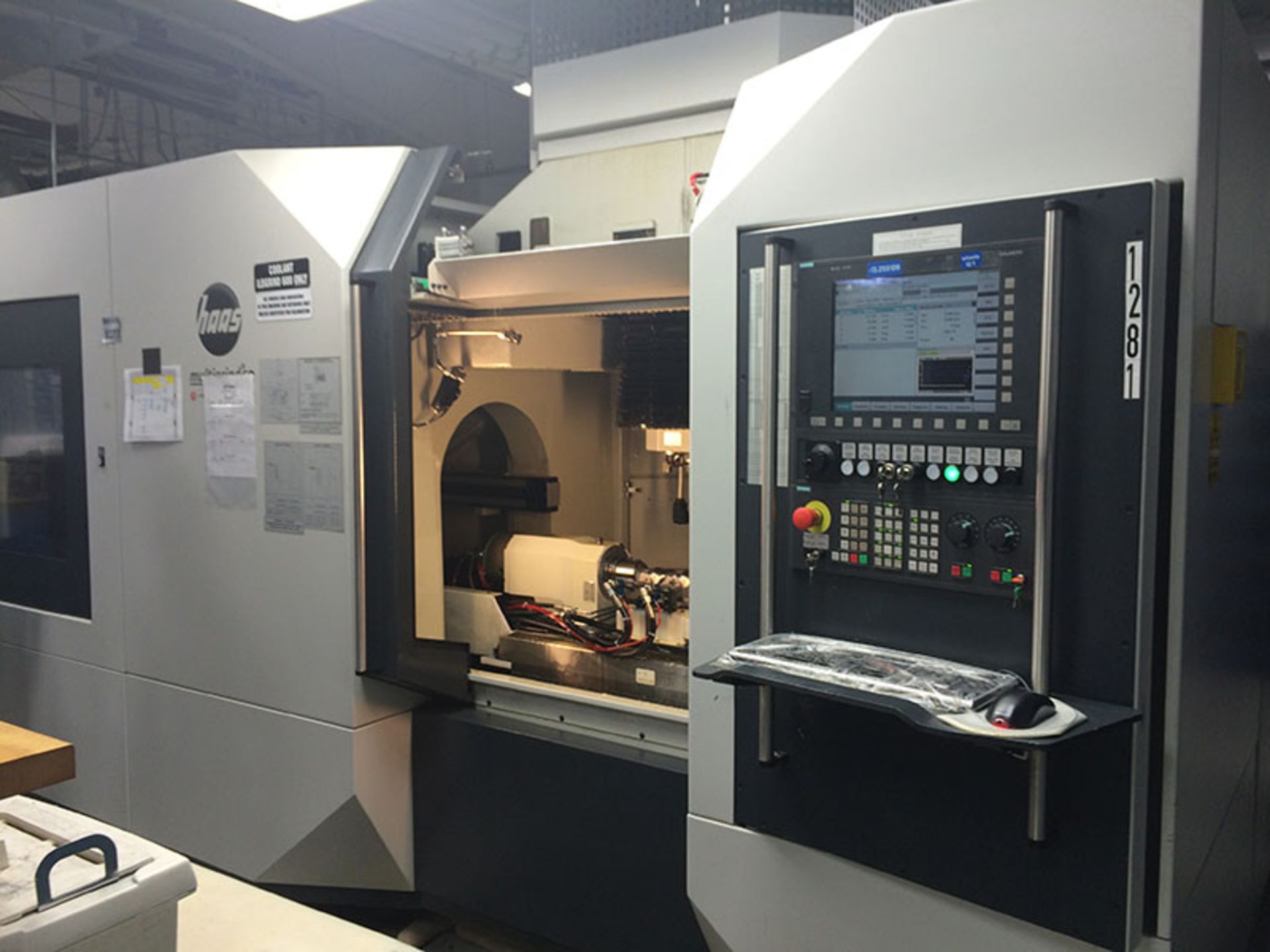 HAAS MULTI AXIS GRINDING CENTER, MODEL MULTIGRIND CB WITH AUTOMATION, YEAR 2008 LOCATION CA