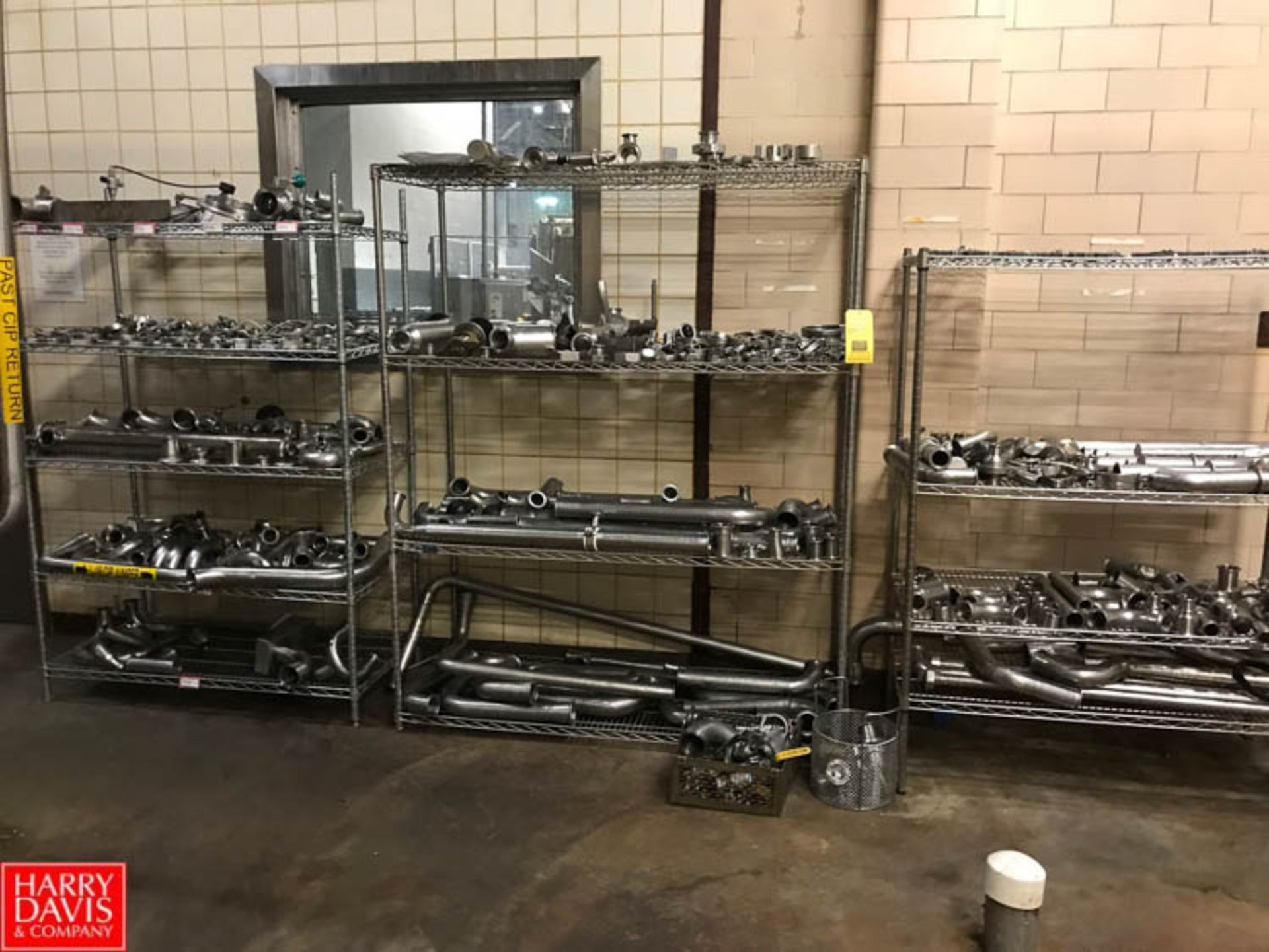 300+ Assorted S/S Clamps, Elbows, Connectors, Check Valves, and more with Racks