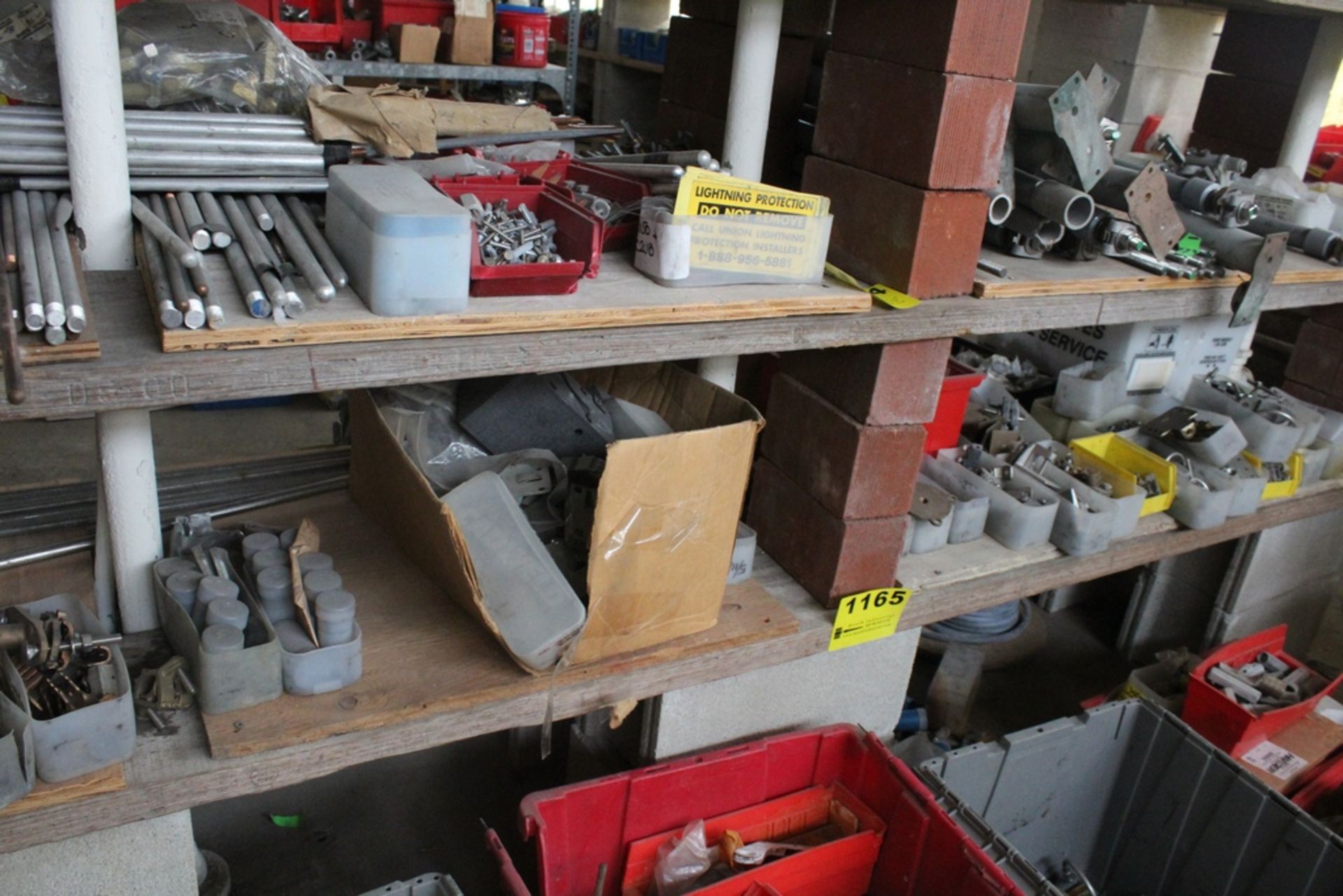 LARGE QTY OF LIGHTENING ROD HARDWARE ON SHELF