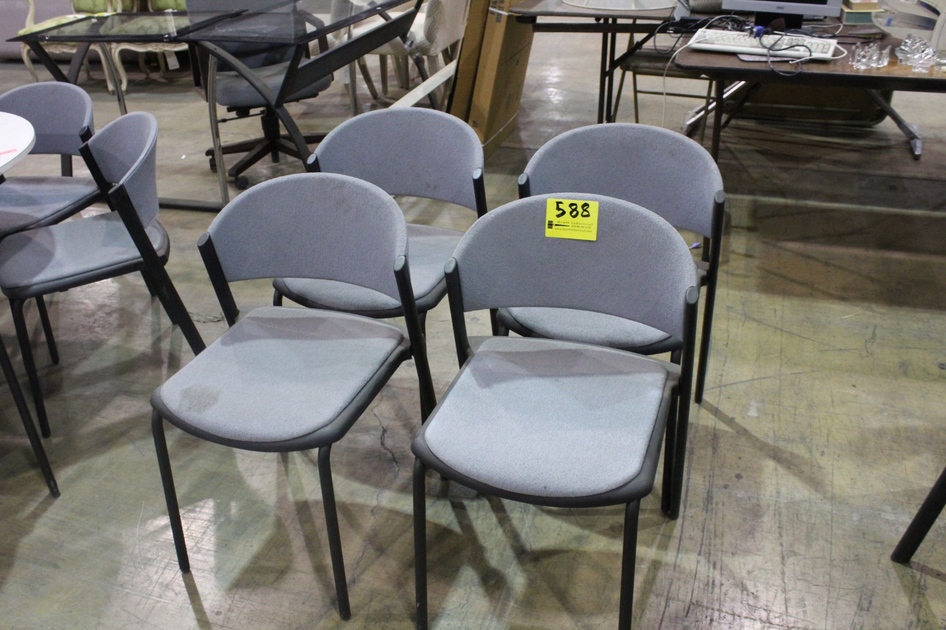 FOUR CLOTH COVERED STACKING CHAIRS