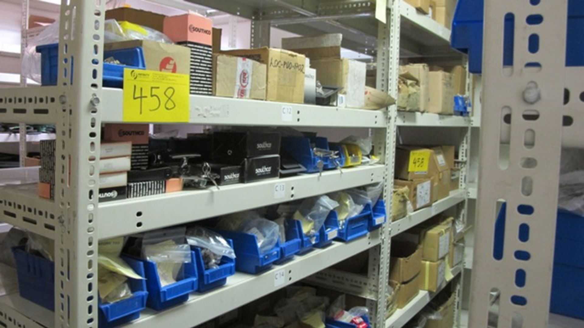 CONTENTS OF 11 SHELVING UNITS (LIGHTS, BELTS, MIXED HARDWARE, ETC) IN PARTS CRIB