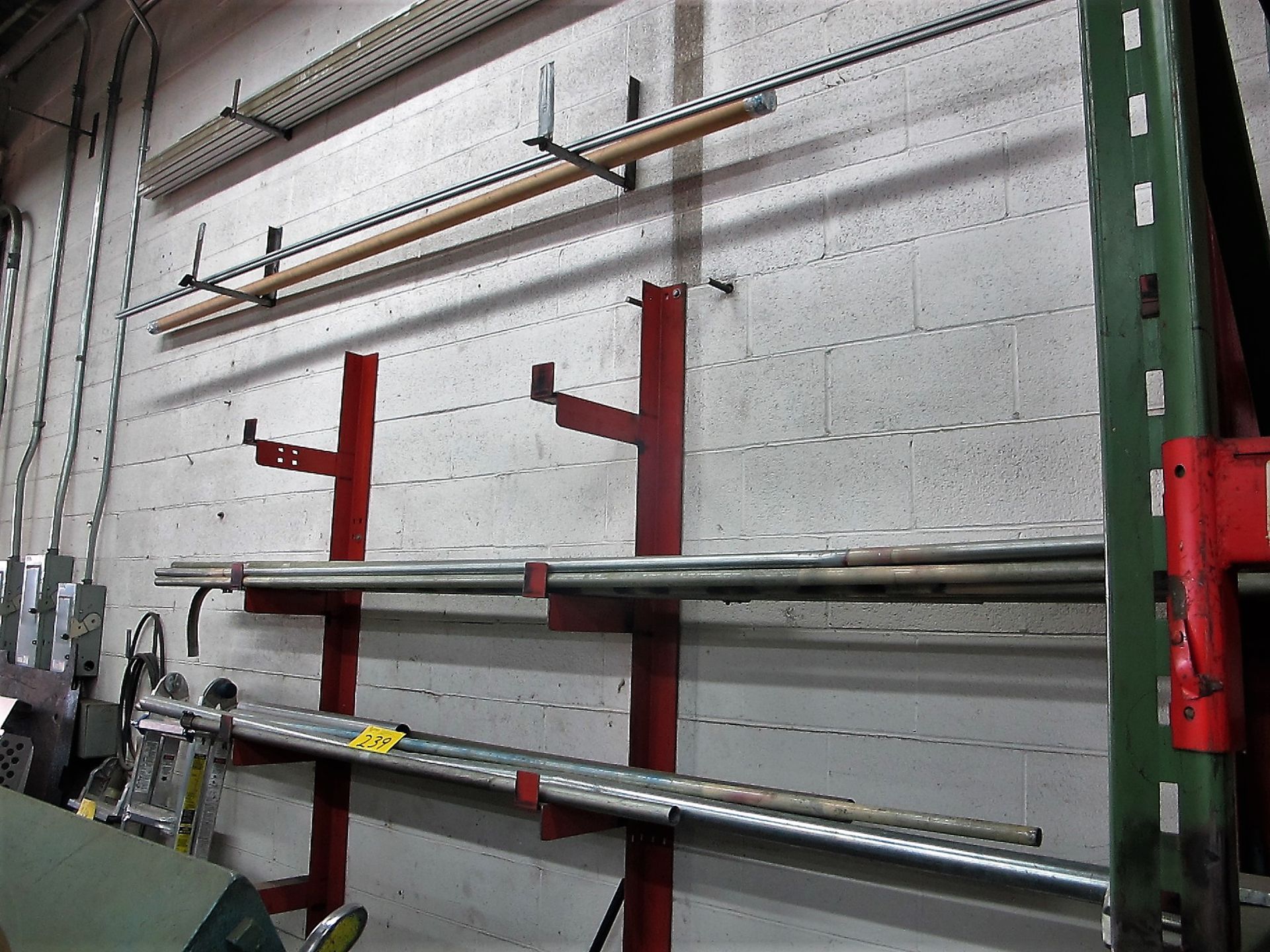 3 METAL WALL RACKS W/TUBE AND EXTRUDED ALUMINUM CONTENTS