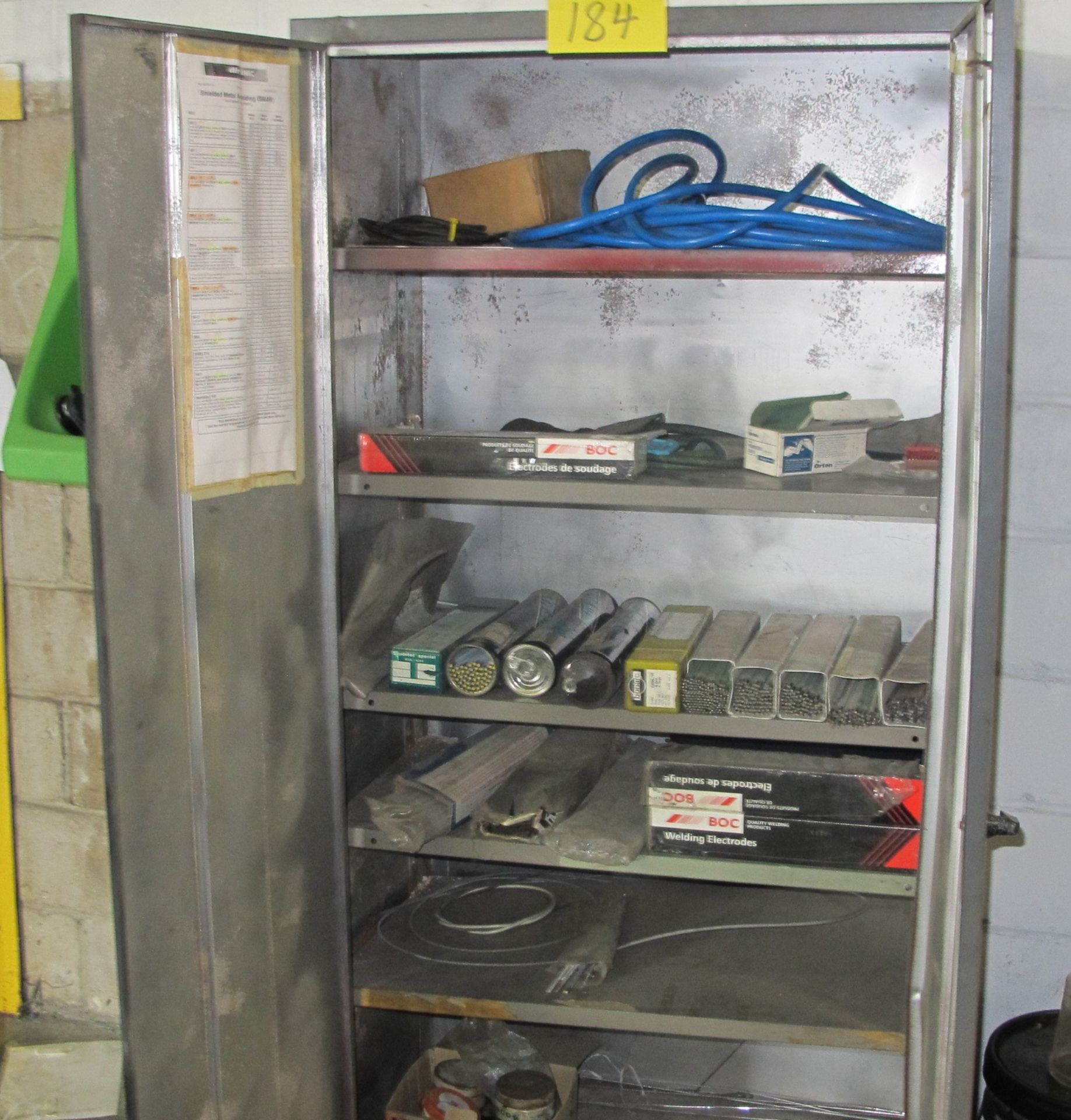 2 DOOR METAL STORAGE CABINET W/WELDING RODS AND WELDING SUPPLIES