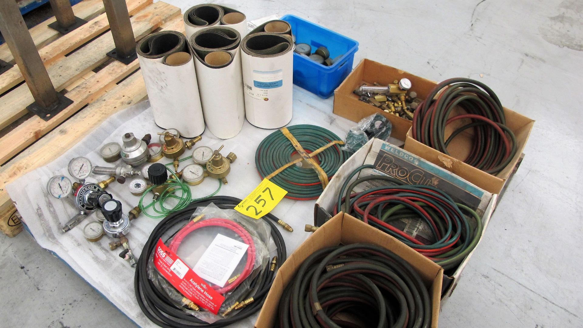 PALLET OF WELDING HOSES, REGULATORS AND SANDING BELTS