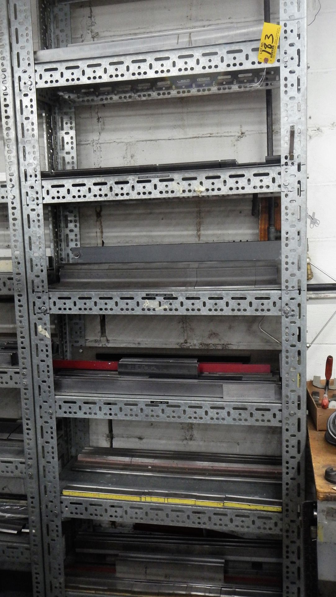 SHELF WITH ASSORTED BRAKE DIES