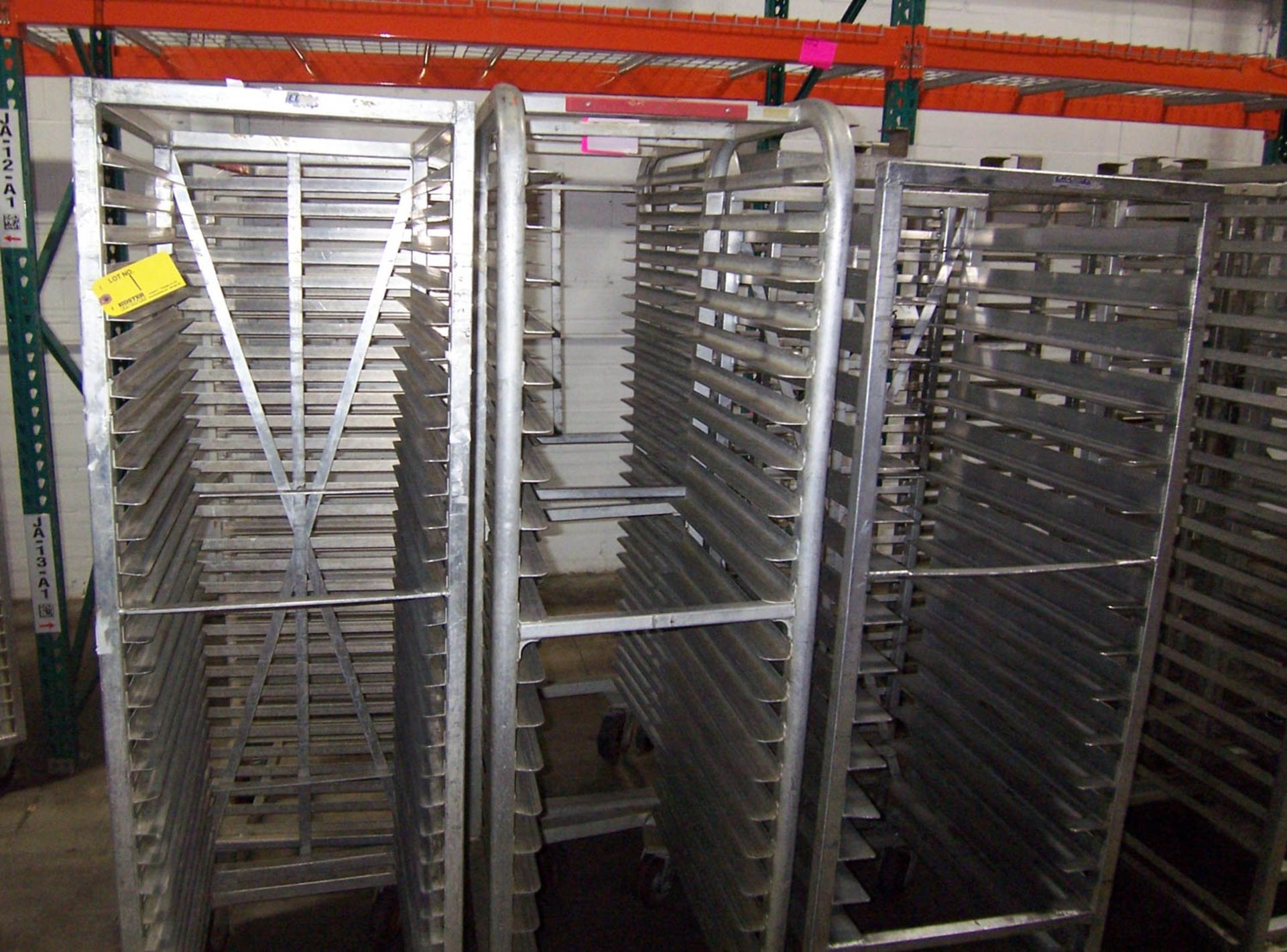 APPROXIMATELY (6) ROLLING ALUMINUM TRAY RACKS