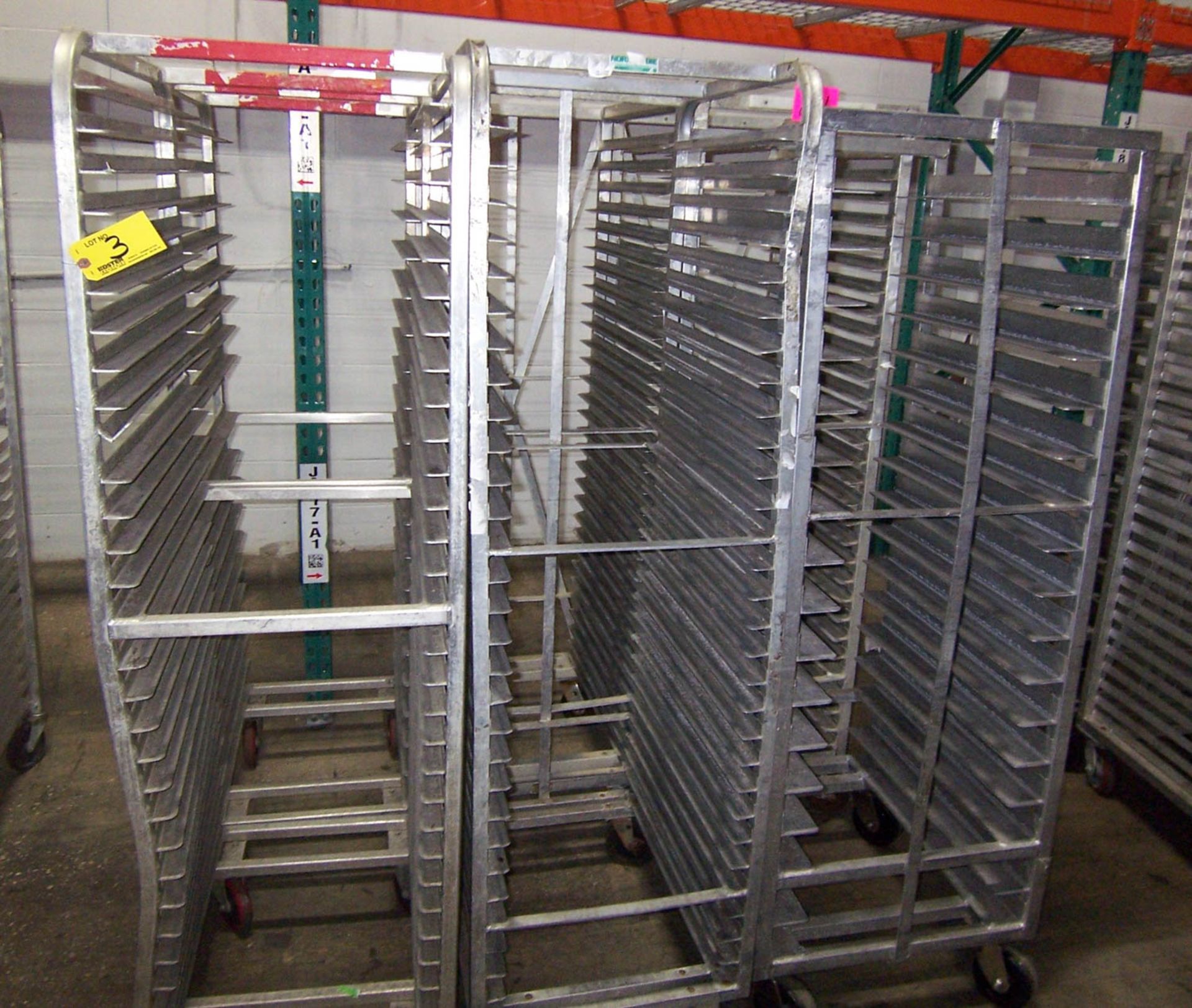 APPROXIMATELY (6) ROLLING ALUMINUM TRAY RACKS