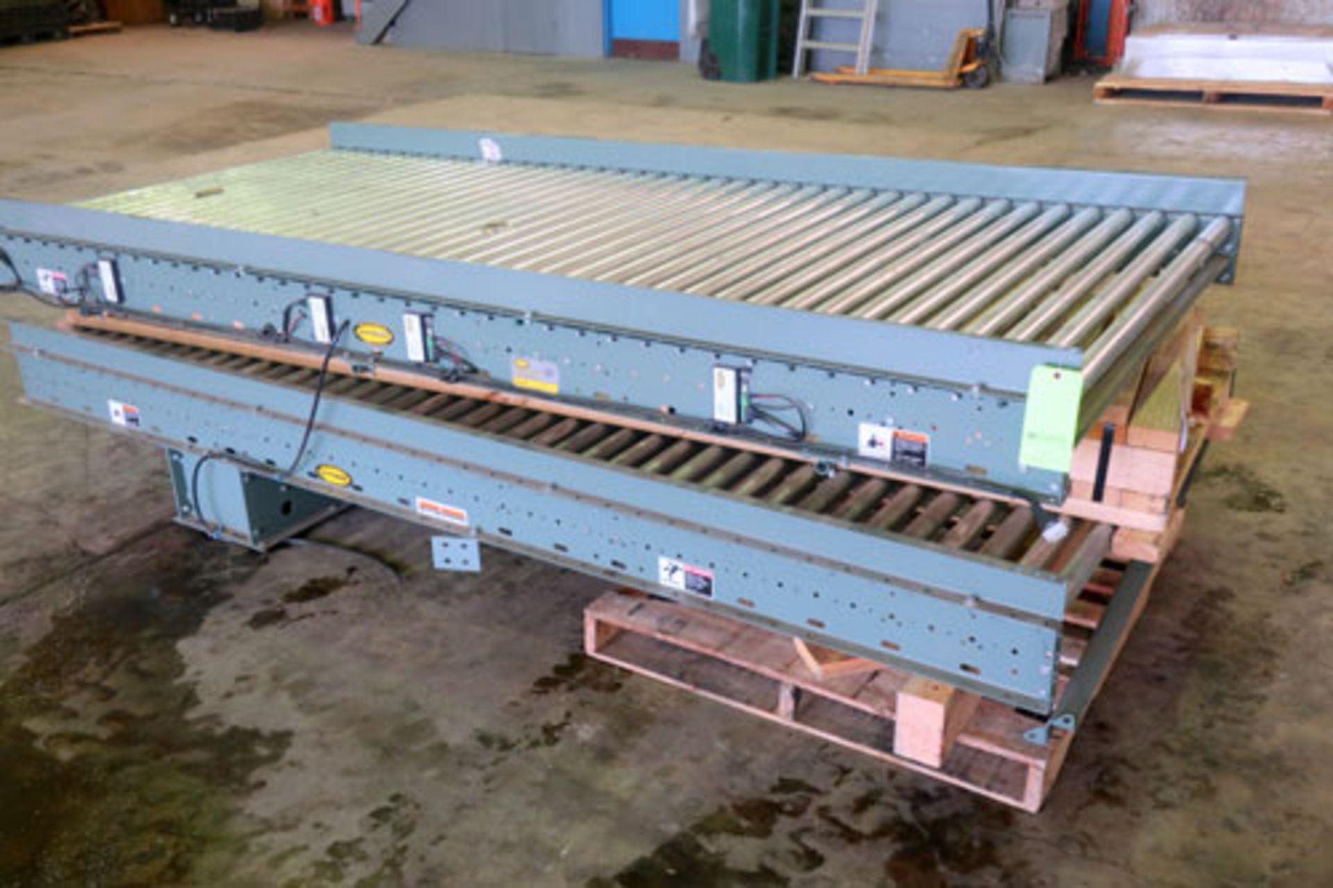 Lot of (2) sections of Hytrol roller conveyor, approximately 52" wide x 10' long.