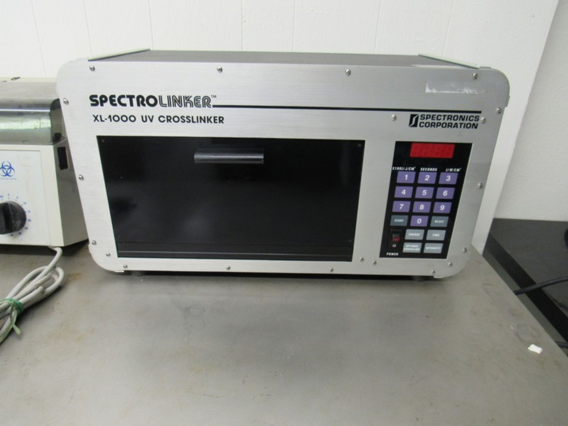 SpectroLinker UV Crosslinker Model XL-1000 by Spectronics Corporation. Free removal and loading.