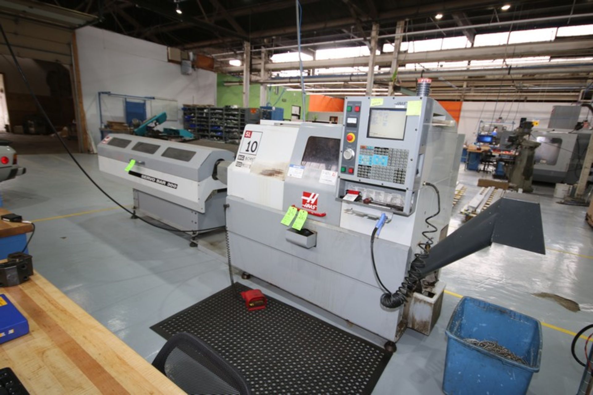 BULK BID: HAAS SL10B Big Bore Turning Center Lathe, S/N 69484, and HAAS Automatic Bar Feeder, M/N