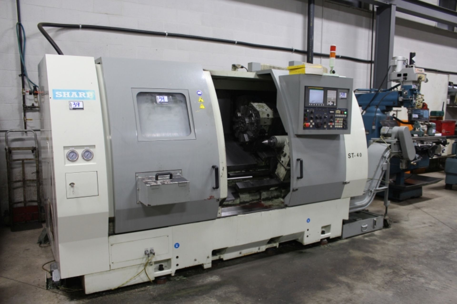 Sharp ST-40, Fanuc 0i-TC, 25” sw, 3” bar cap. 27.6” centers, 3000 RPM, 12" Chuck, S/N 5907218, New - Image 7 of 11