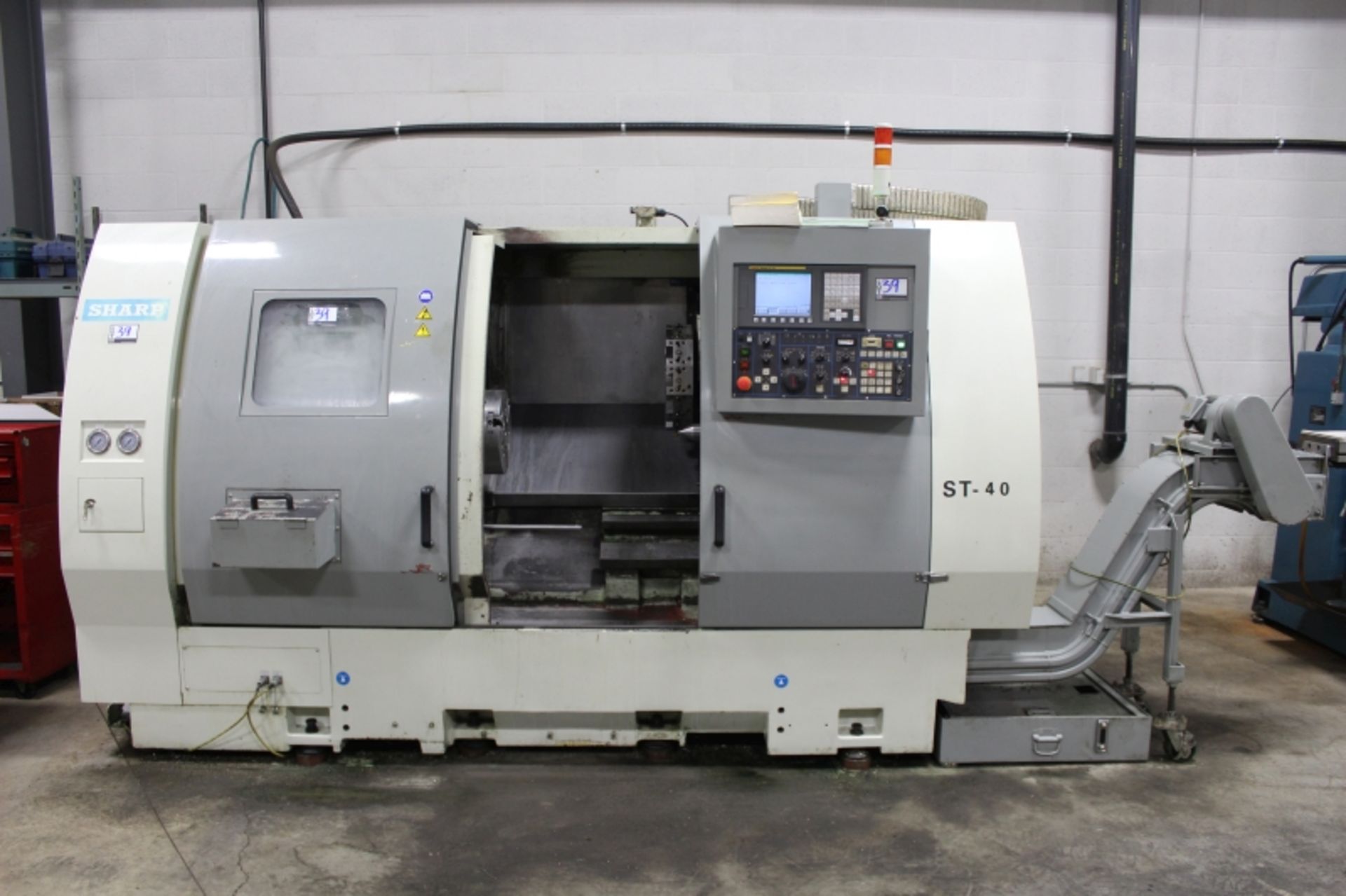 Sharp ST-40, Fanuc 0i-TC, 25” sw, 3” bar cap. 27.6” centers, 3000 RPM, 12" Chuck, S/N 5907218, New - Image 4 of 11