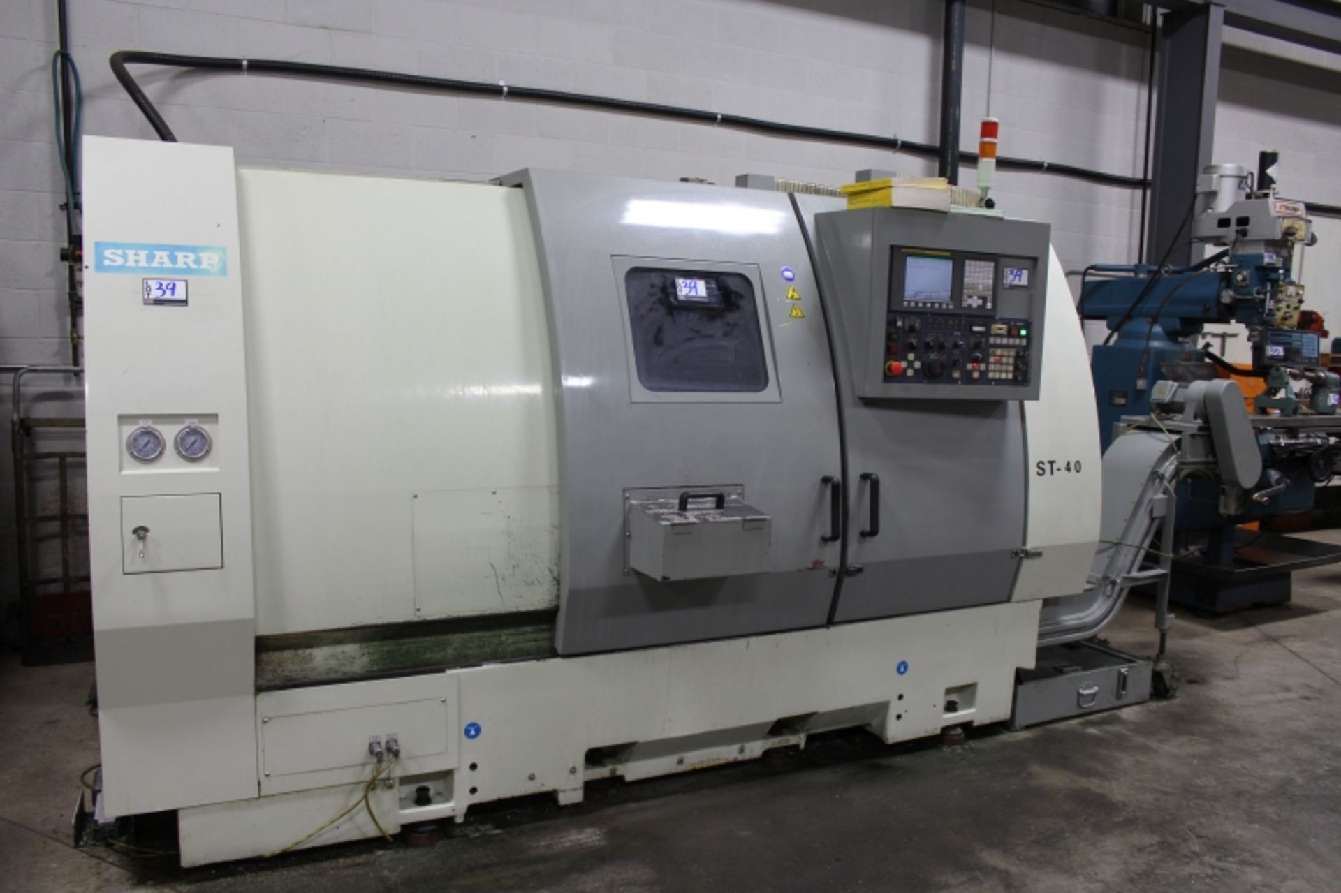 Sharp ST-40, Fanuc 0i-TC, 25” sw, 3” bar cap. 27.6” centers, 3000 RPM, 12" Chuck, S/N 5907218, New - Image 3 of 11