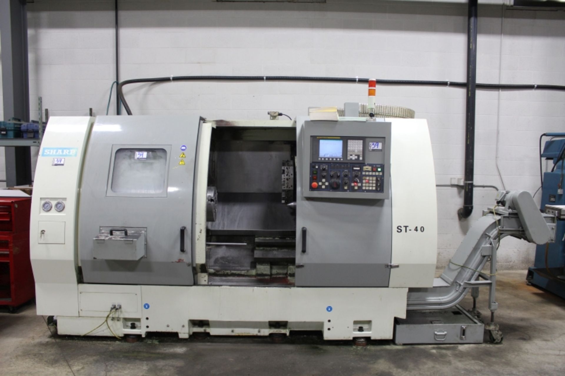 Sharp ST-40, Fanuc 0i-TC, 25” sw, 3” bar cap. 27.6” centers, 3000 RPM, 12" Chuck, S/N 5907218, New - Image 5 of 11