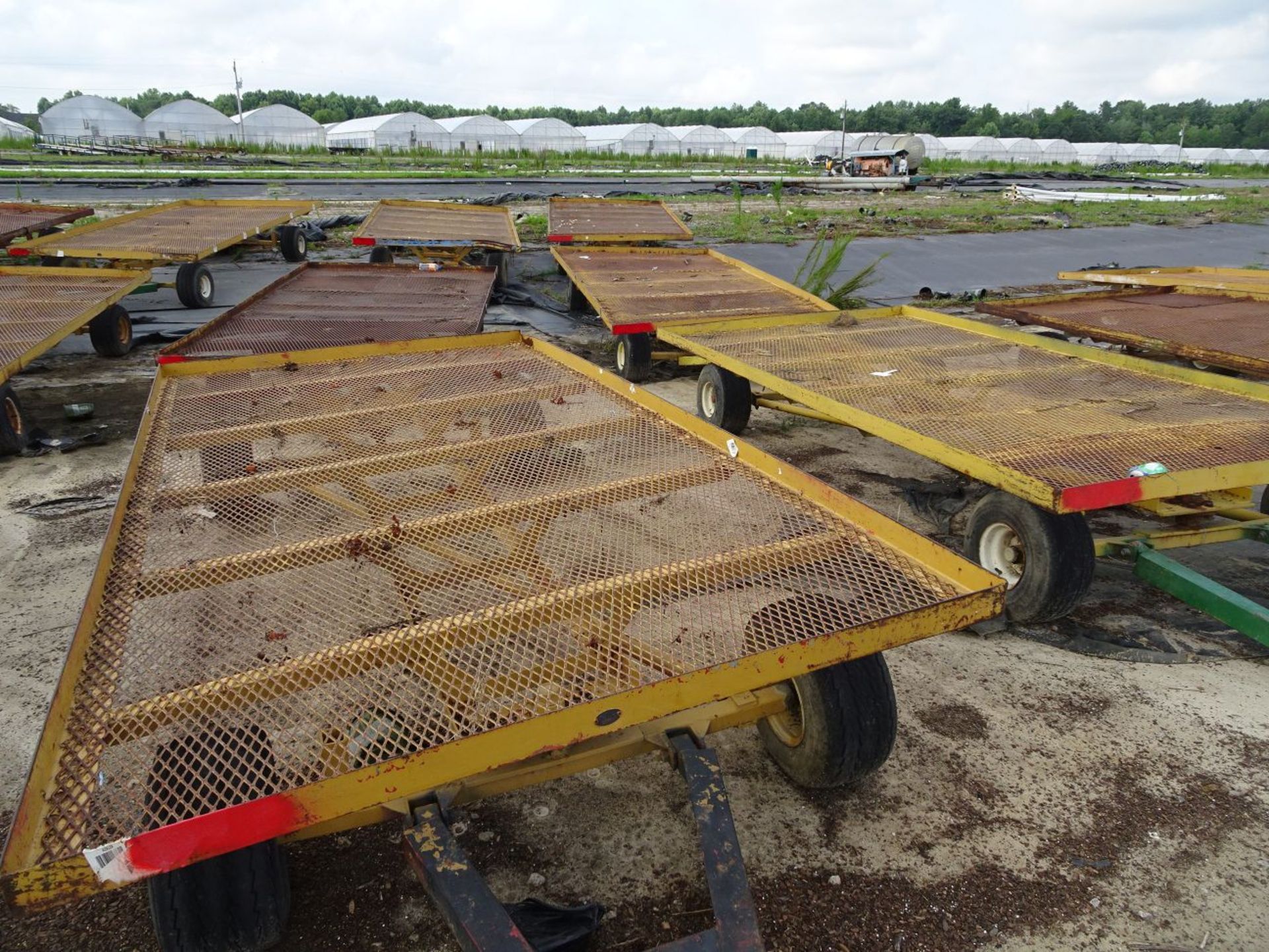 (6) SELF TRACKING TRAILERS, EACH IS PIN STYLE HITCH, EACH TRAILER BED IS 12' LONG x 6' WIDE (FOR