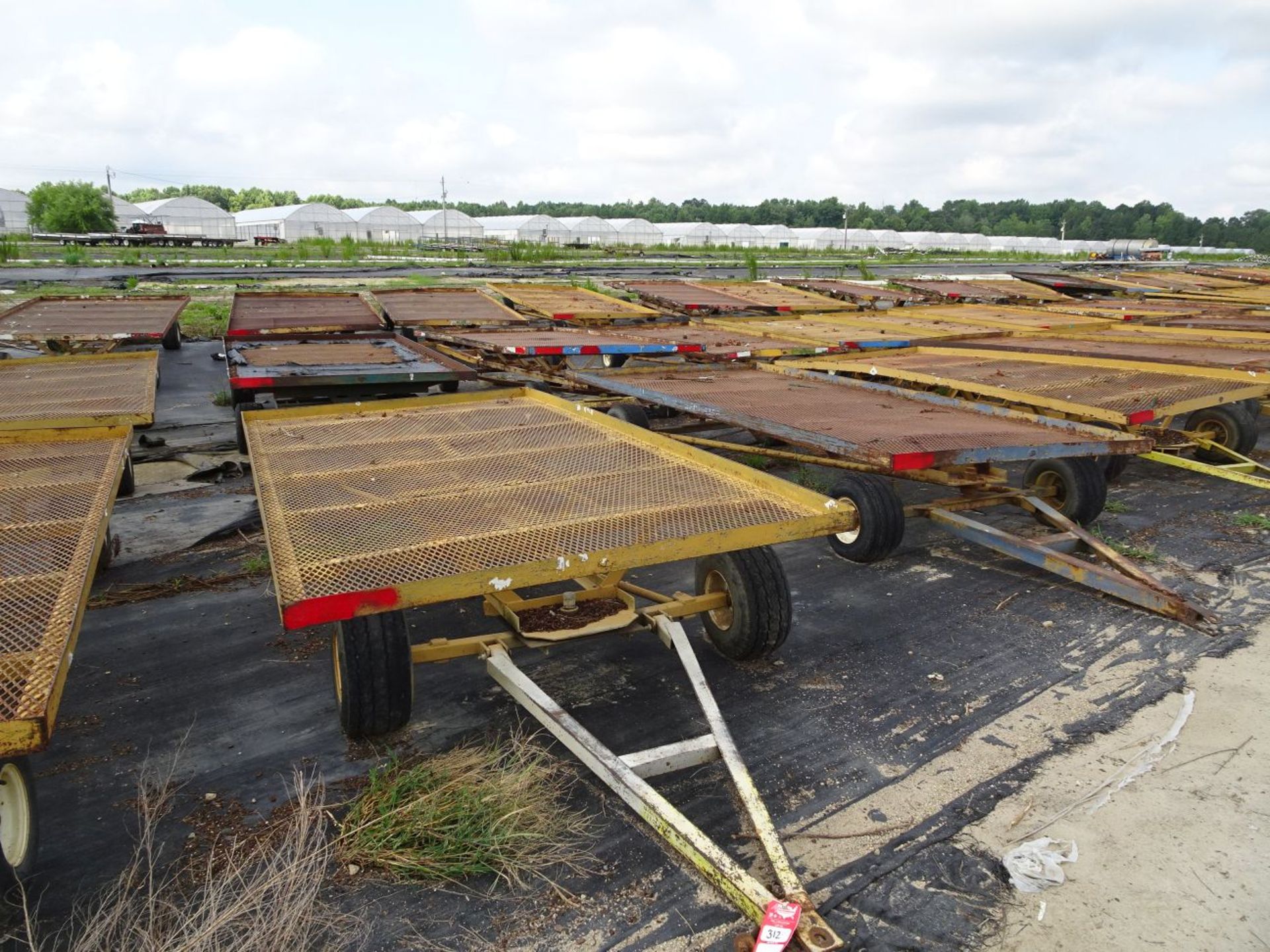 (6) SELF TRACKING TRAILERS, EACH IS PIN STYLE HITCH, EACH TRAILER BED IS 12' LONG x 6' WIDE (FOR