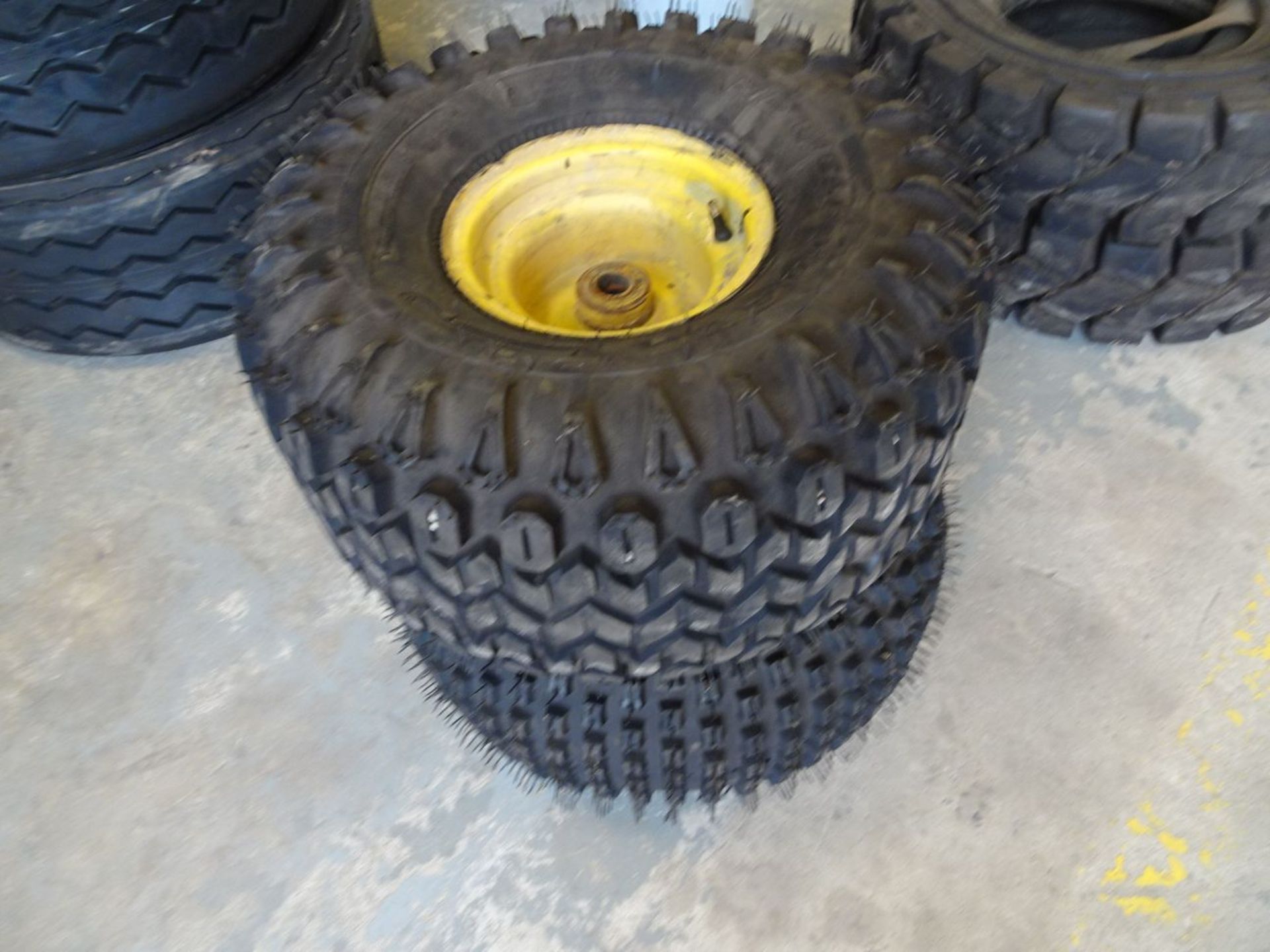 (2) NEW CARLISLE AT22.5X10/8 TIRES AND RIMS (LOCATION: SHOP)